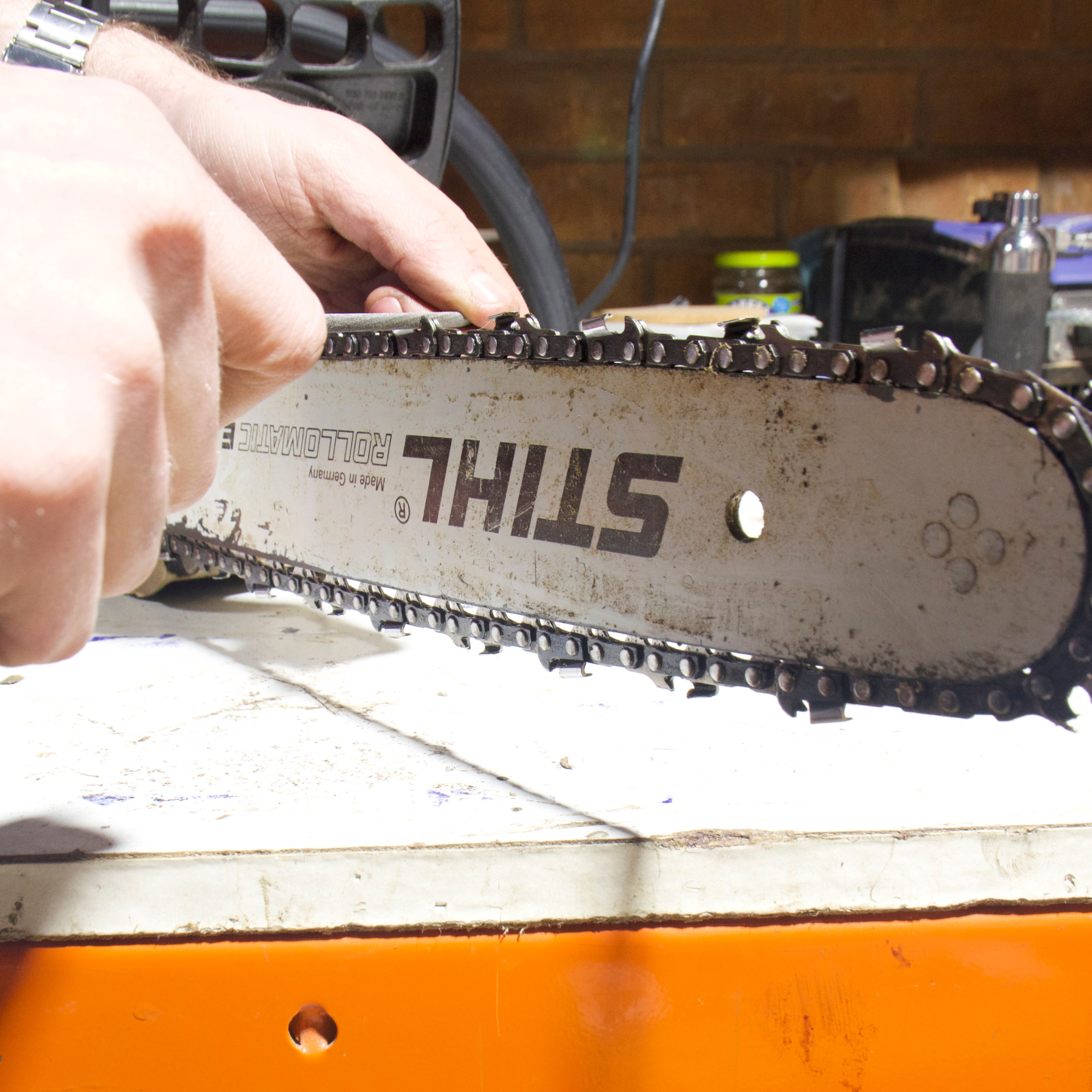 Chainsaw being sharpened
