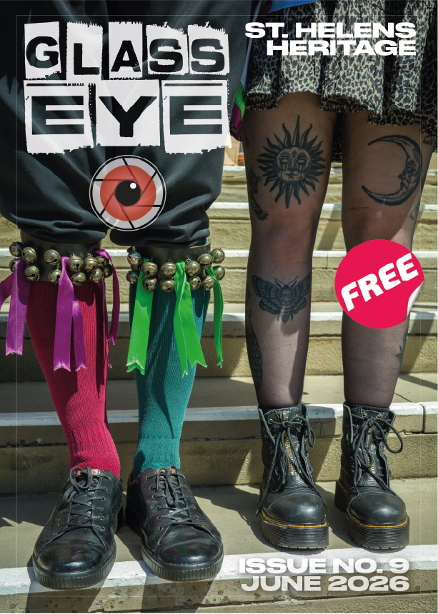 Cover of a magazine titled 'Glass Eye' featuring two people standing on stairs. The person on the left wears black shoes and colorful socks with purple and green ribbons and jingle bells, and has a tattoo on their thigh. The person on the right wears black boots and sheer stockings with tattoos, including a sun and moon. The magazine issue is from June 2026, and it is a free issue.
