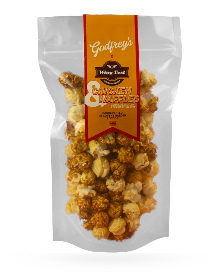 Packaged Godfrey's Wing Fest chicken and waffle popcorn with caramel and chicken-spiced corn inside a clear plastic bag.