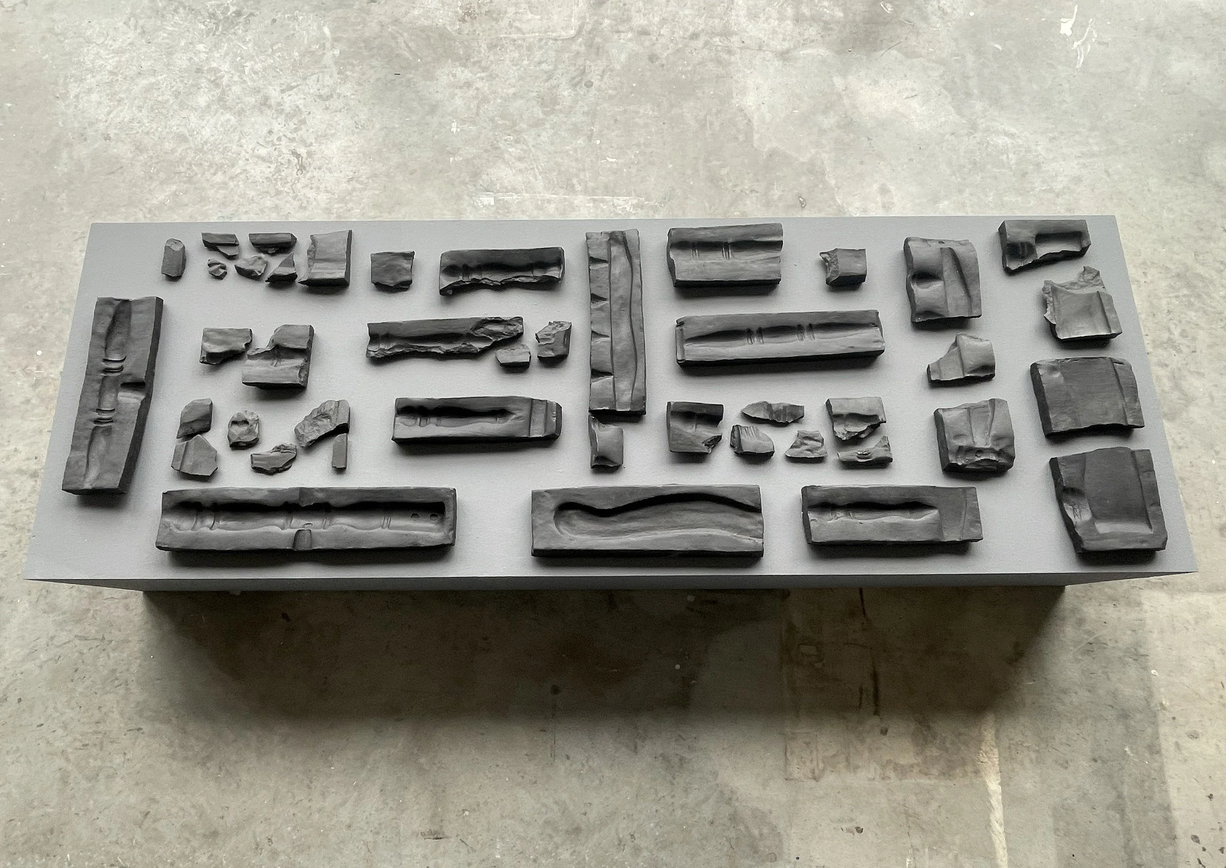 A Memory Lost, a Memory Found, 2023. Ceramic casts of a chair, 175 × 50 × 70 cm.