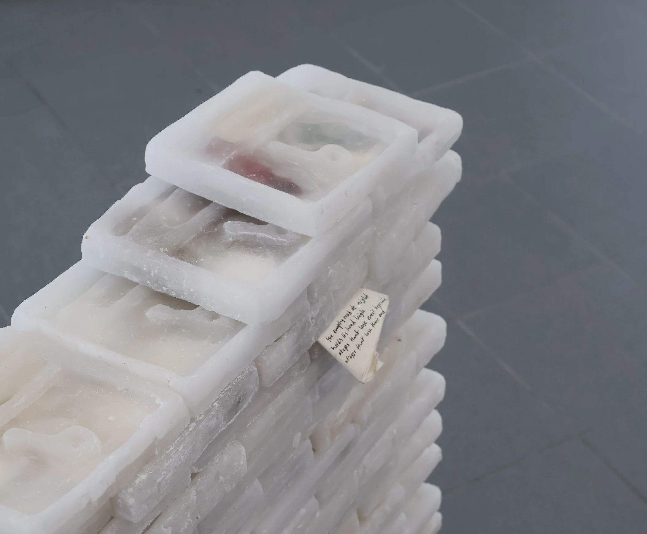 Adresse suspended, 2026. Wax, plaster, ceramic, paper (detail).