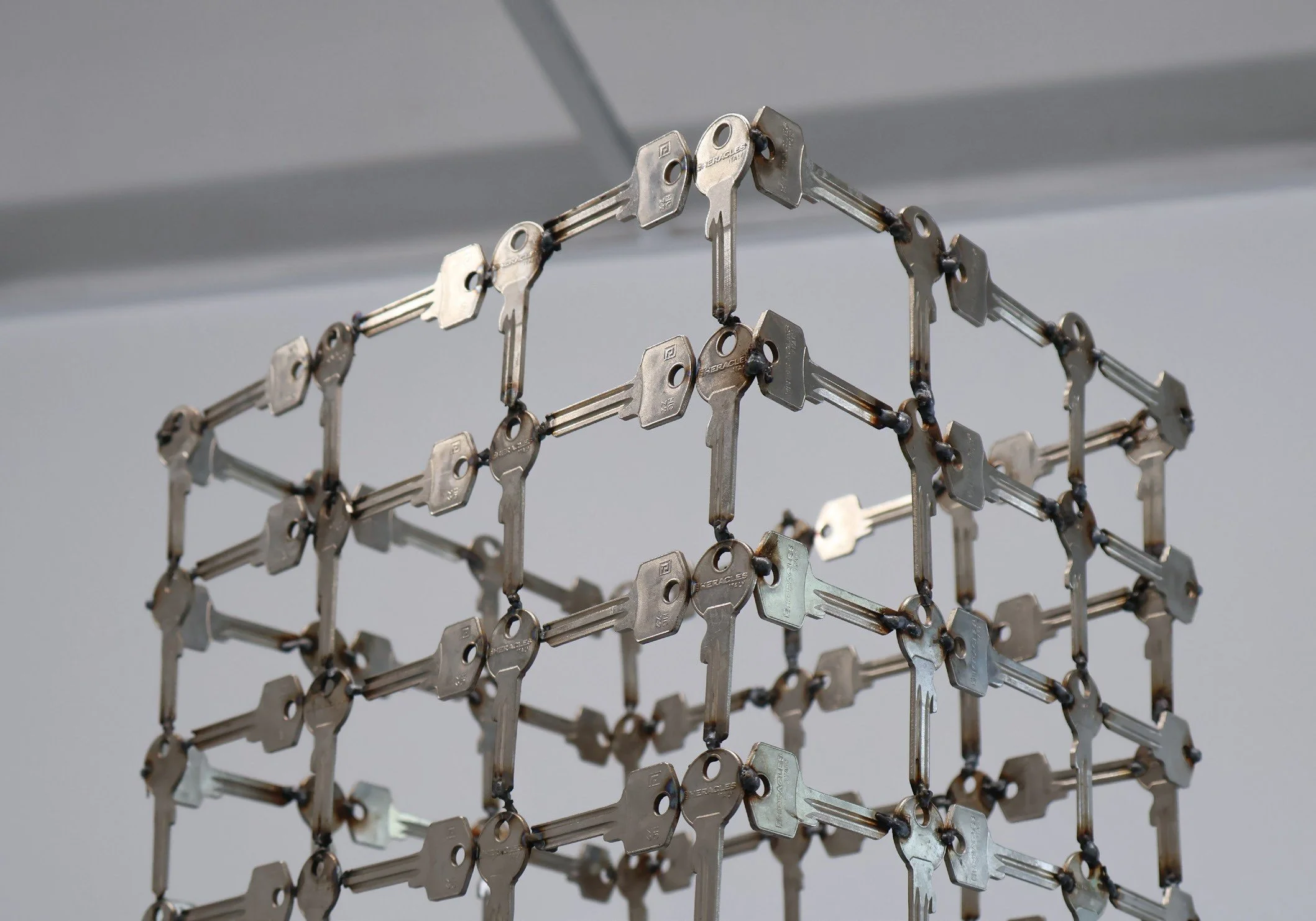 The Sacred Void, 2023. Keys, tar, MDF, 200 × 60 × 80 cm.