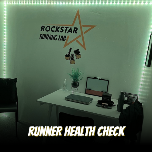 A workspace with a desk and chair in a fitness or health lab, with a sign on the wall reading 'Rockstar Running Lab' and a star logo, surrounded by green LED lights, and the words 'Runner Health Check' at the bottom.