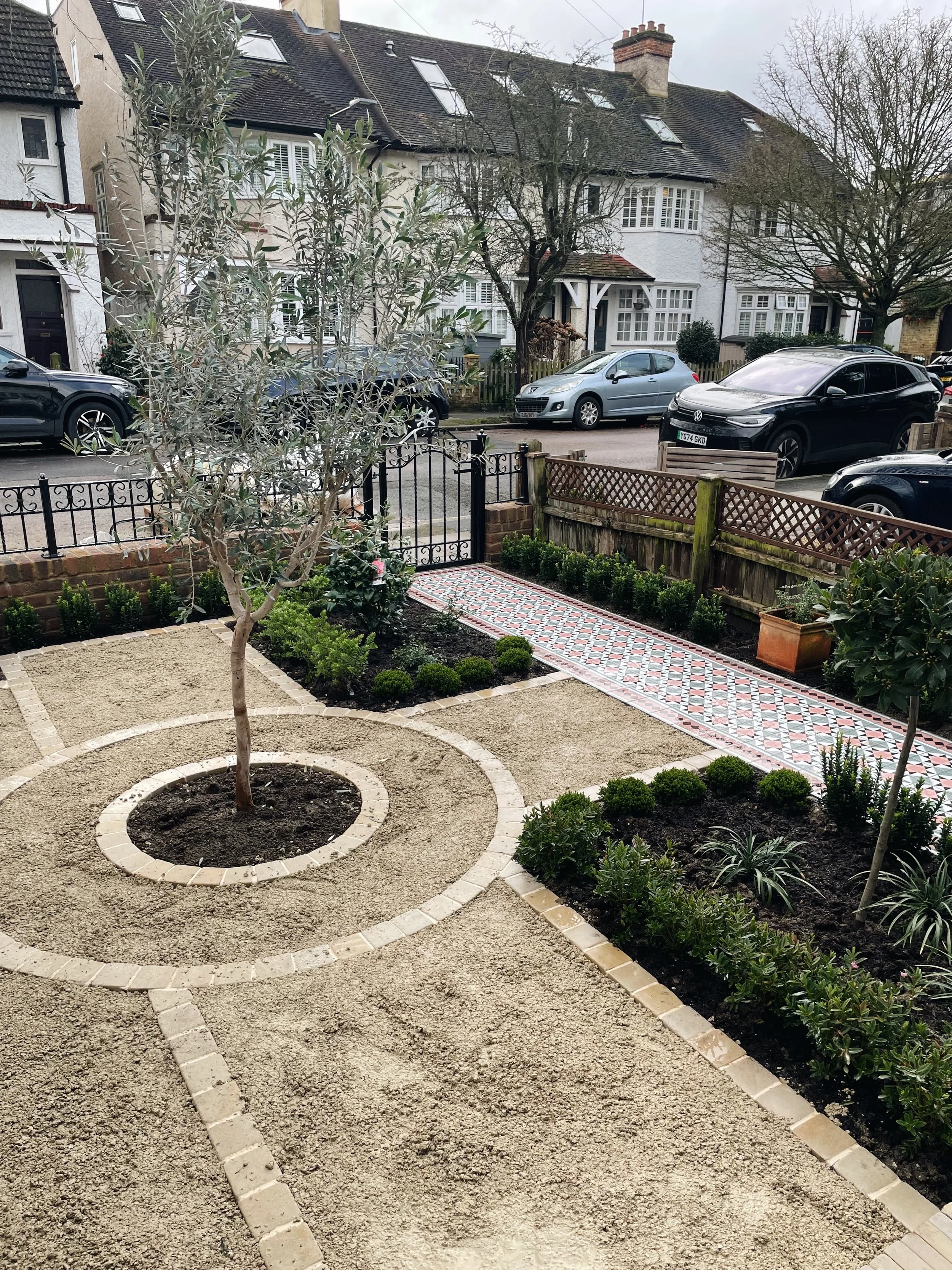 This elegant front garden transformation showcases our expertise in bespoke garden design, premium landscaping