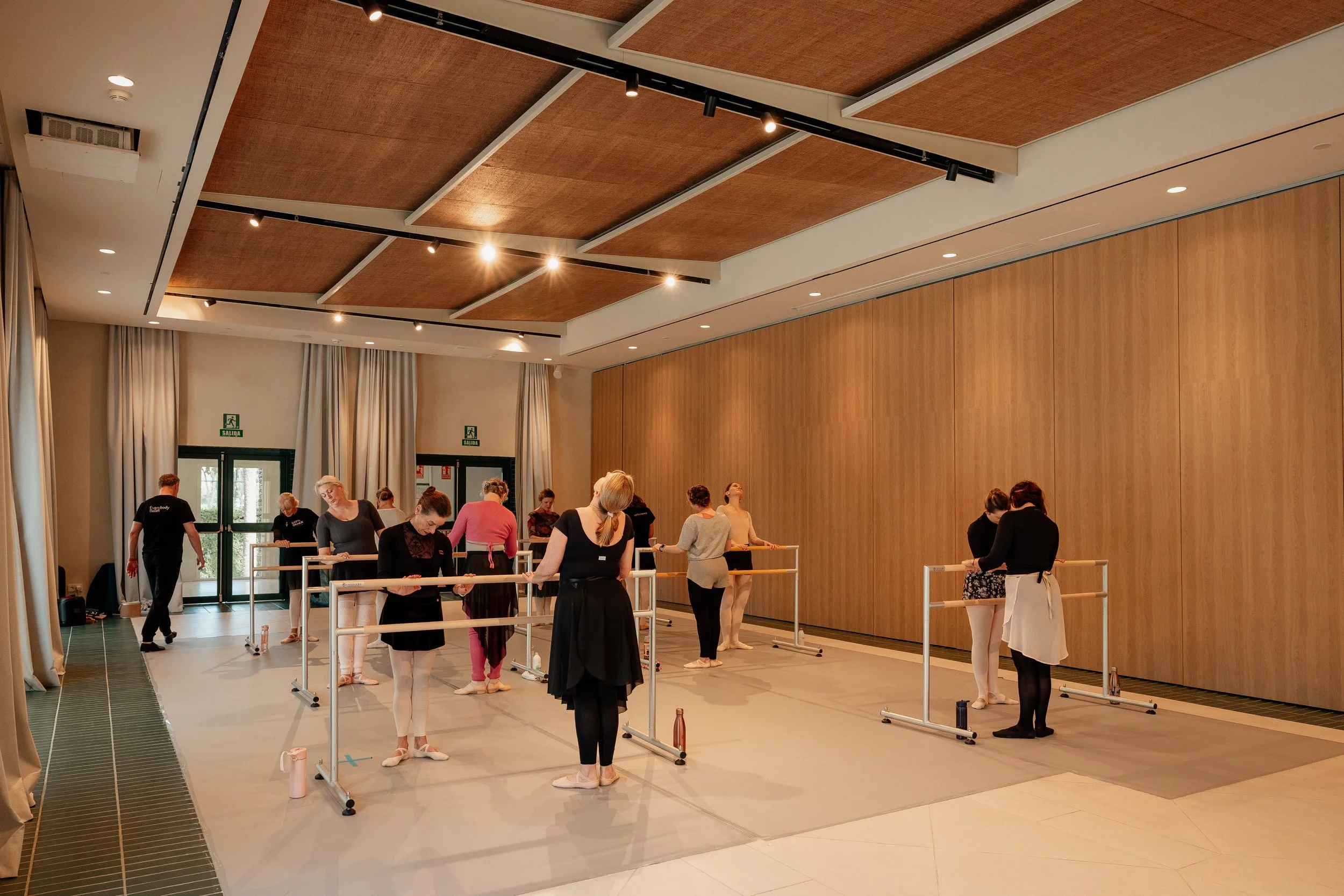 Ballet class practicing in a Spanish dance studio.