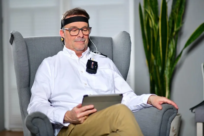 A guy getting neurofeedback therapy.