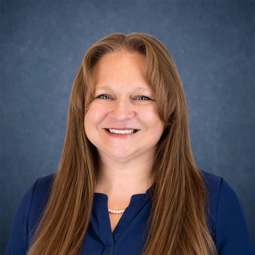 A headshot of Belinda Fogde, smiling.