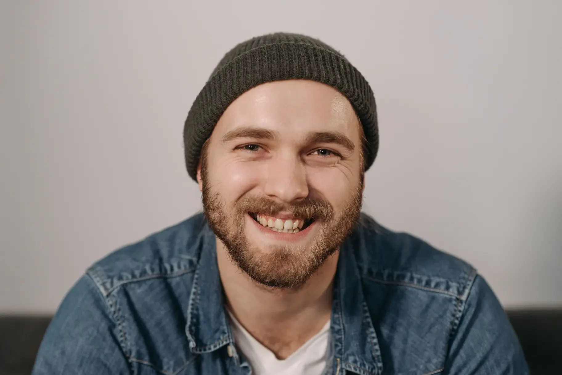 Smiling man wearing a bonnet