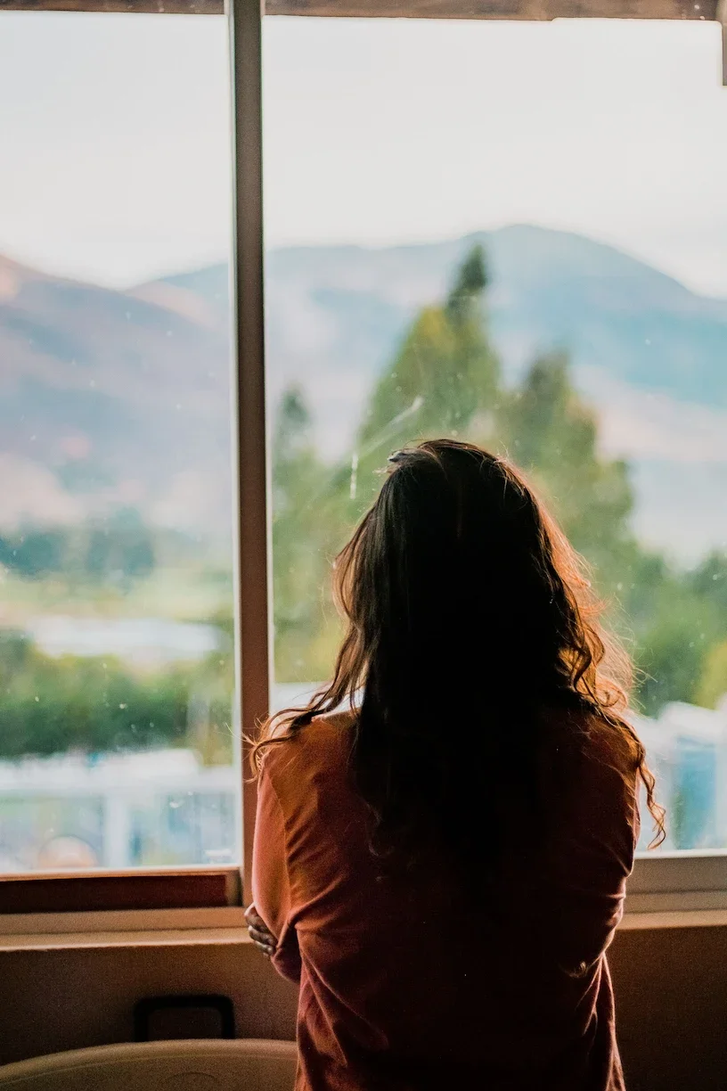 A woman looking out the window