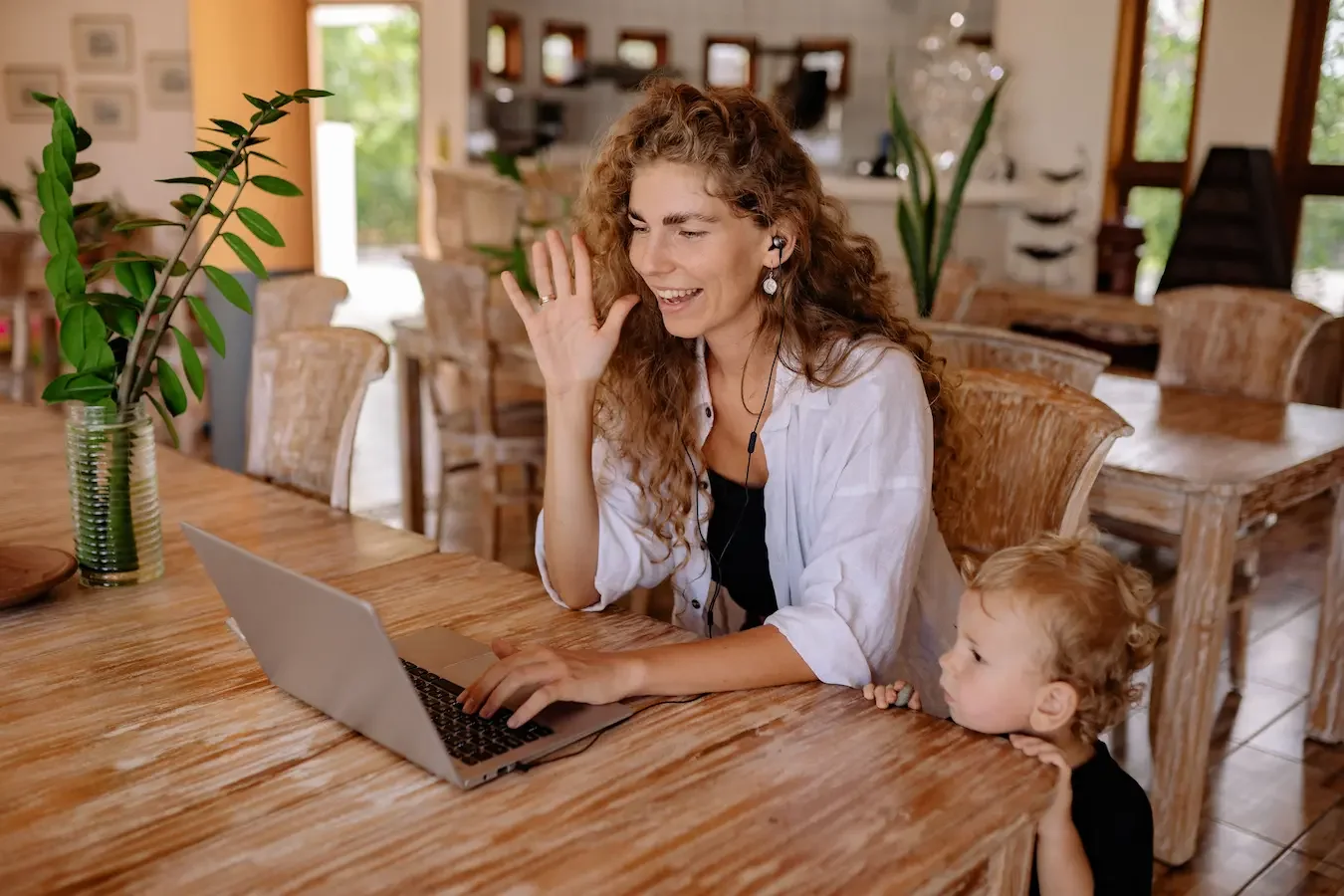 Mother with child using laptop