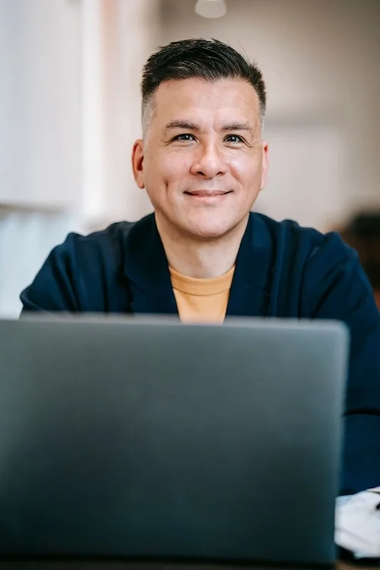 Guy on computer.