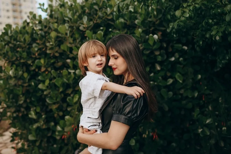 A mother holding her son.