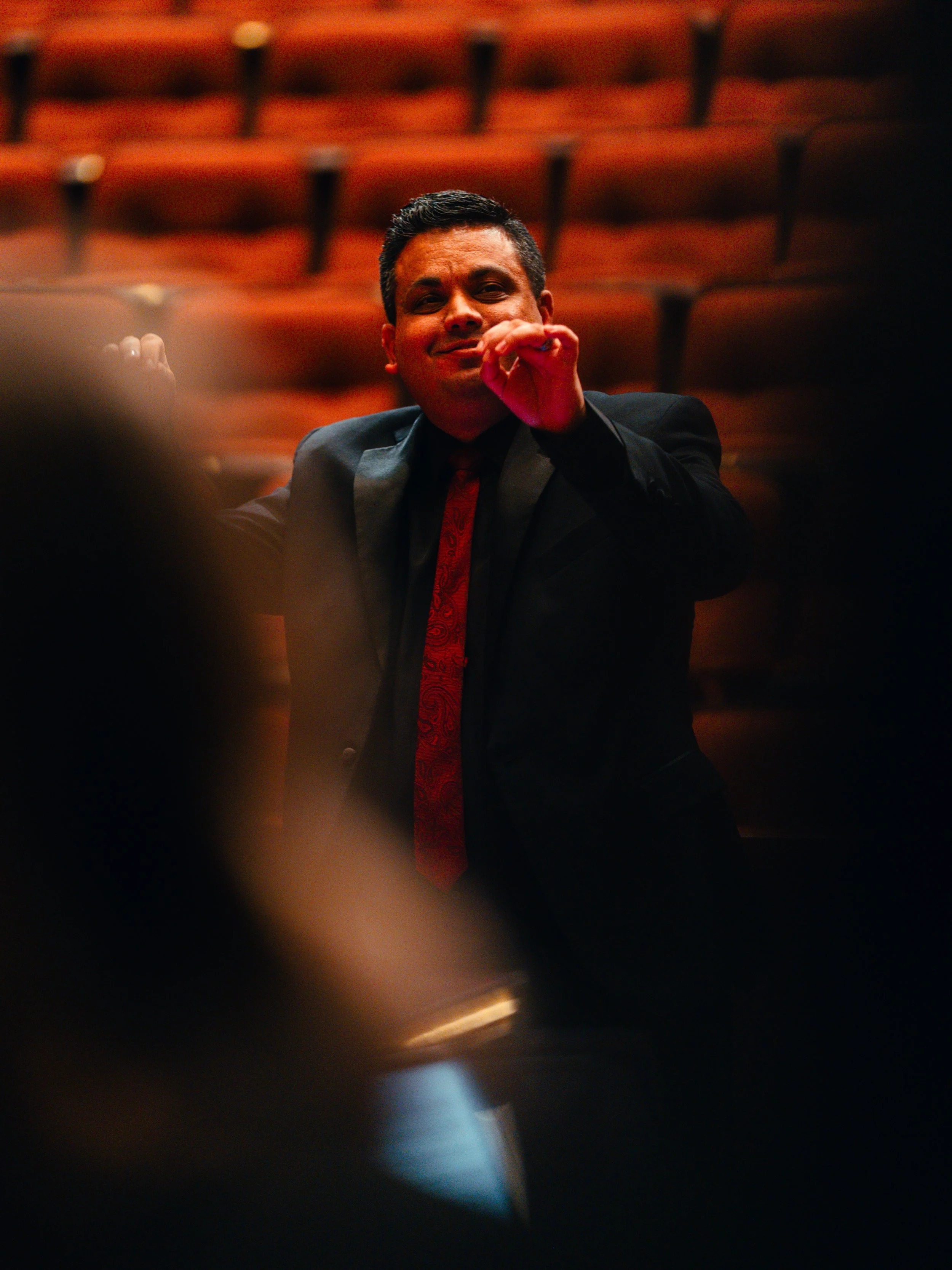 Benjamin conducts the Southern Virginia University Chamber Singers in a performance at the Washington D.C. Temple Visitors' Center