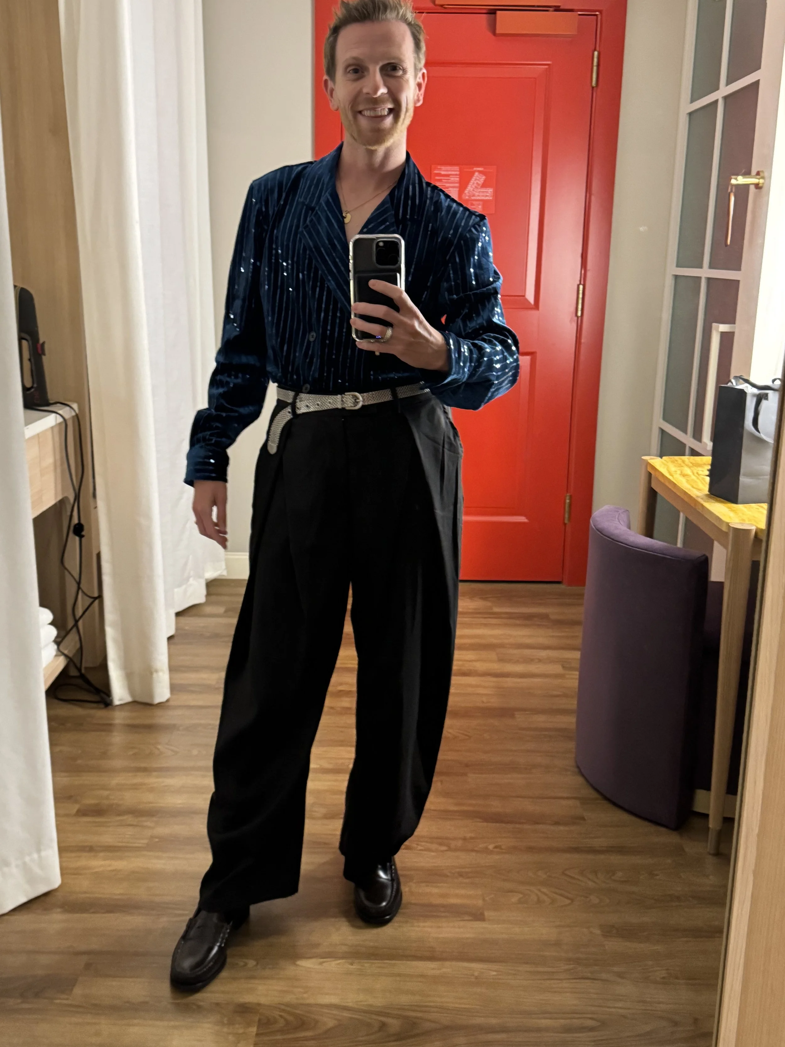 Real closing night outfit with blue sequined shirt and wide-leg trousers