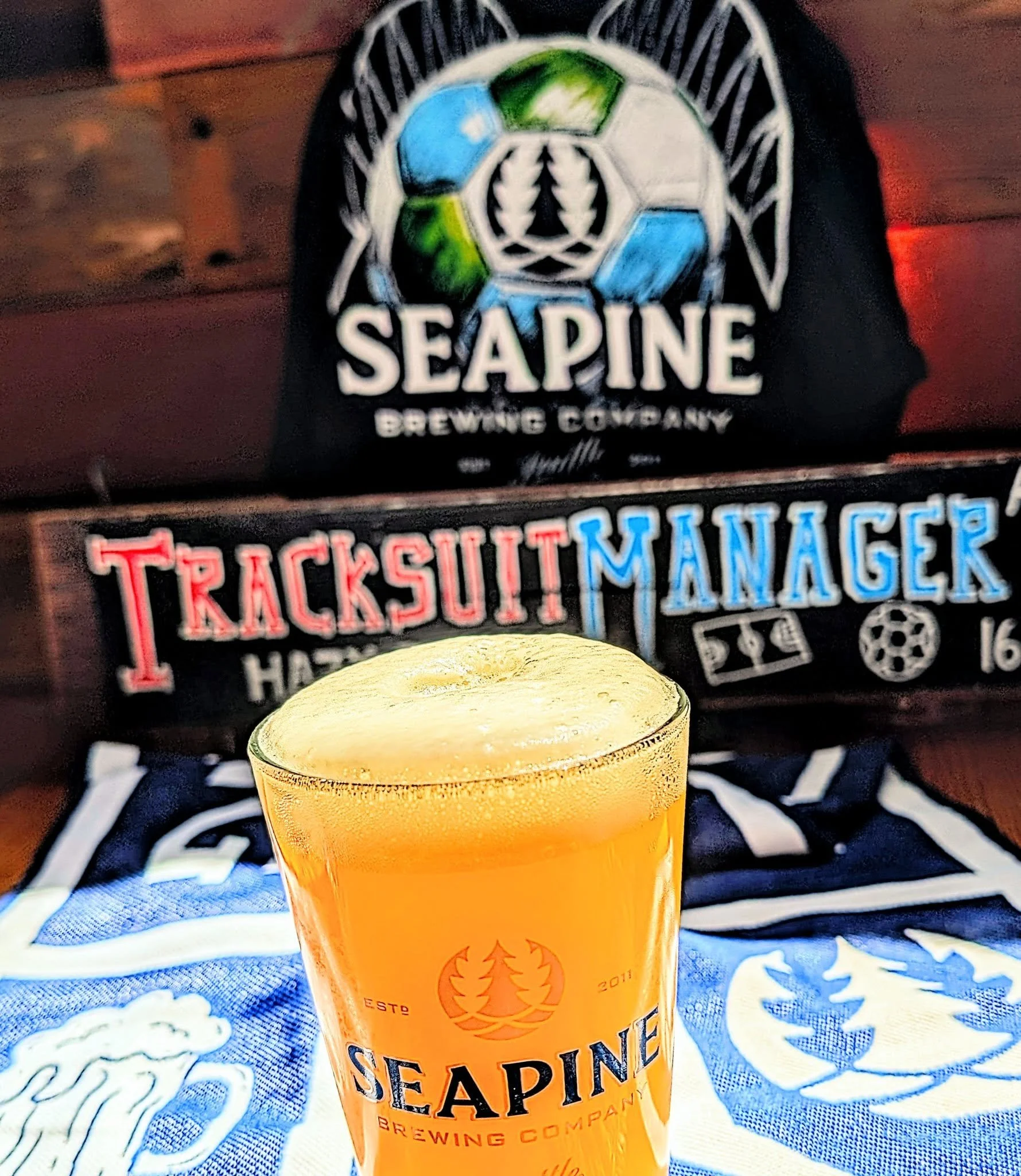 🚨New beer just tapped!🚨Tracksuit Manager Hazy IPA (6.2%)! 
Bright melon &amp; orange flavors from Cashmere &amp; Krush hops combine with light herbaceous notes from Strata hops for a well balanced hazy IPA.  Draft only: serving now and throughout t