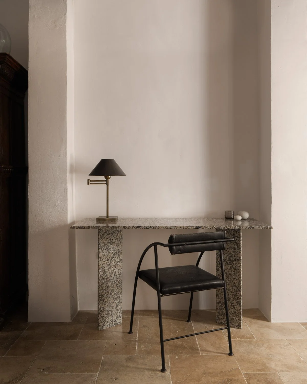 Custom marble desk by Atelier Valencia with vintage leather chair