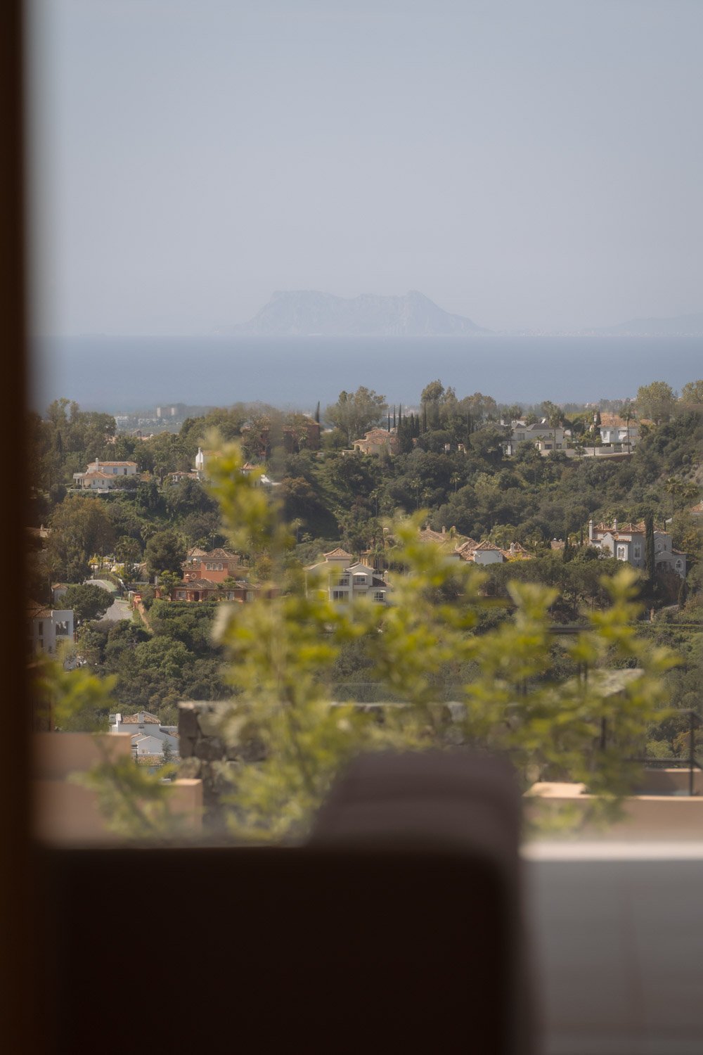 Distant view of the Rock of Gibraltar from a residential window.