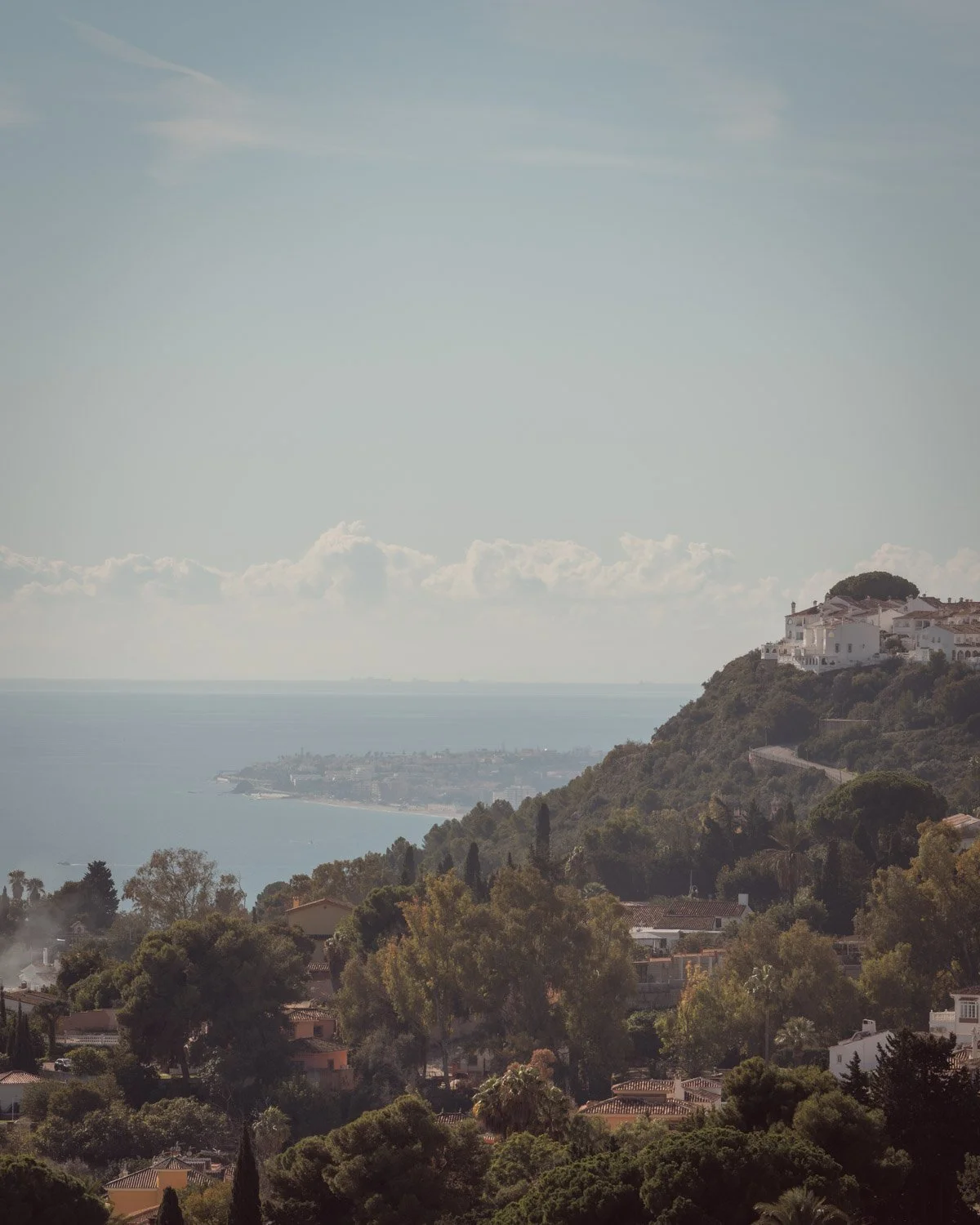 Cinematic coastal landscape featuring hillside homes along the Costa del Sol