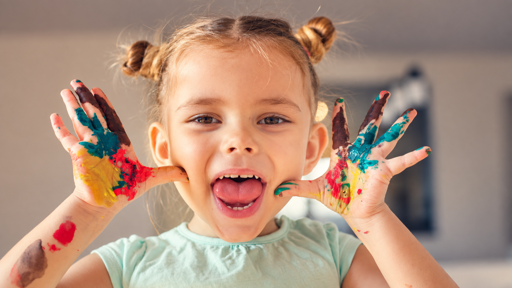 Child with autism enjoying a colorful sensory painting activity