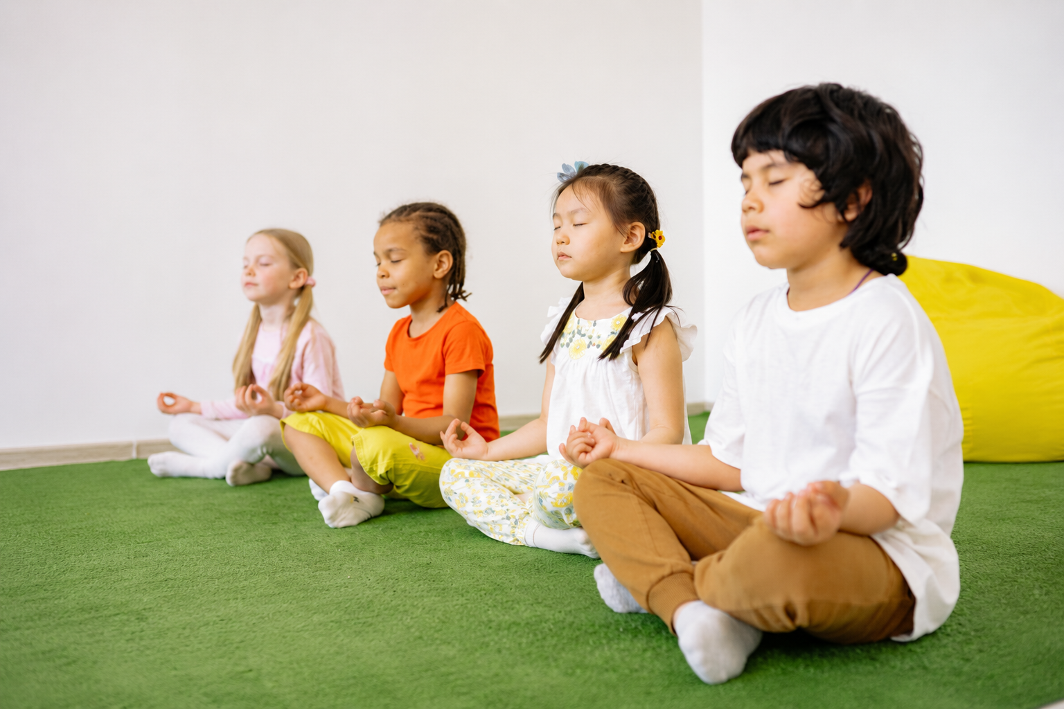 Children practicing mindfulness and breathing exercises together