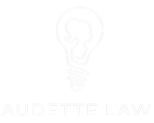 Audette Law logo which includes the words Audette Law and the image of a light bulb with the profile of a woman's head inside the bulb