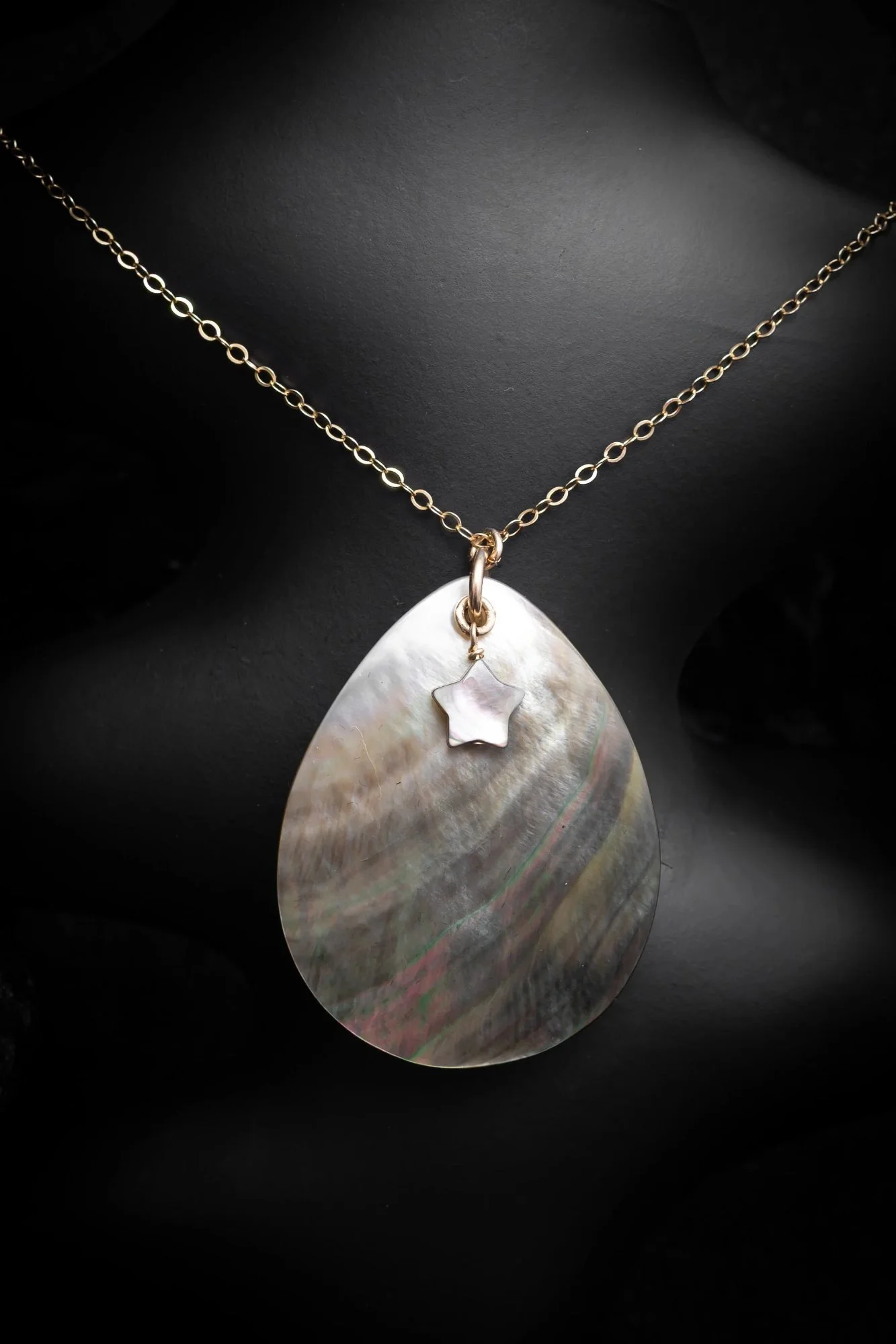 Exotic elegance,  naturally iridescent green and purple tones seem to dance in the light, each piece is  unique.