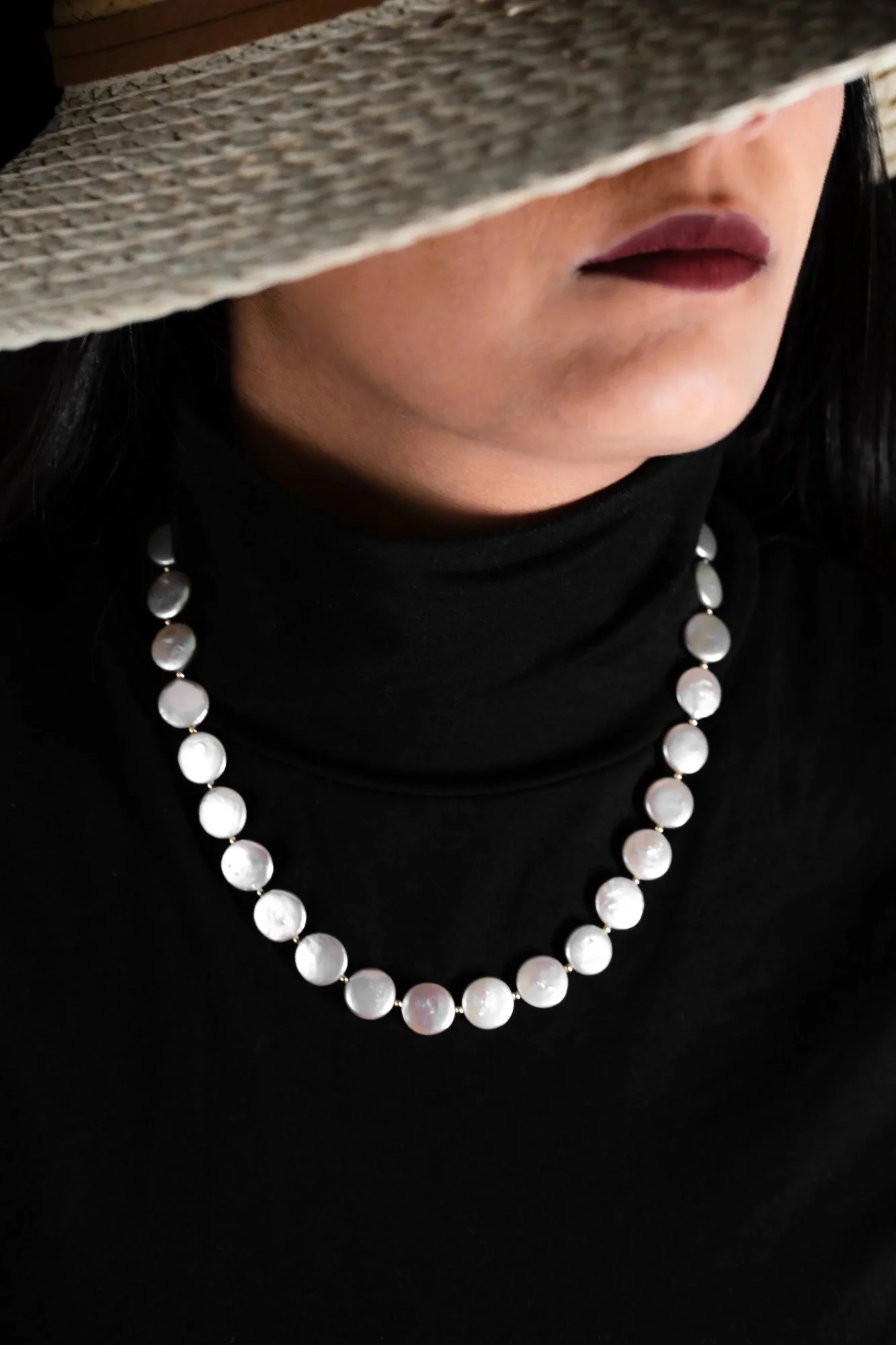 Quiet Luxury speaks the loudest - lustrous smooth grey coin shaped beads form a distinctive pearl necklace