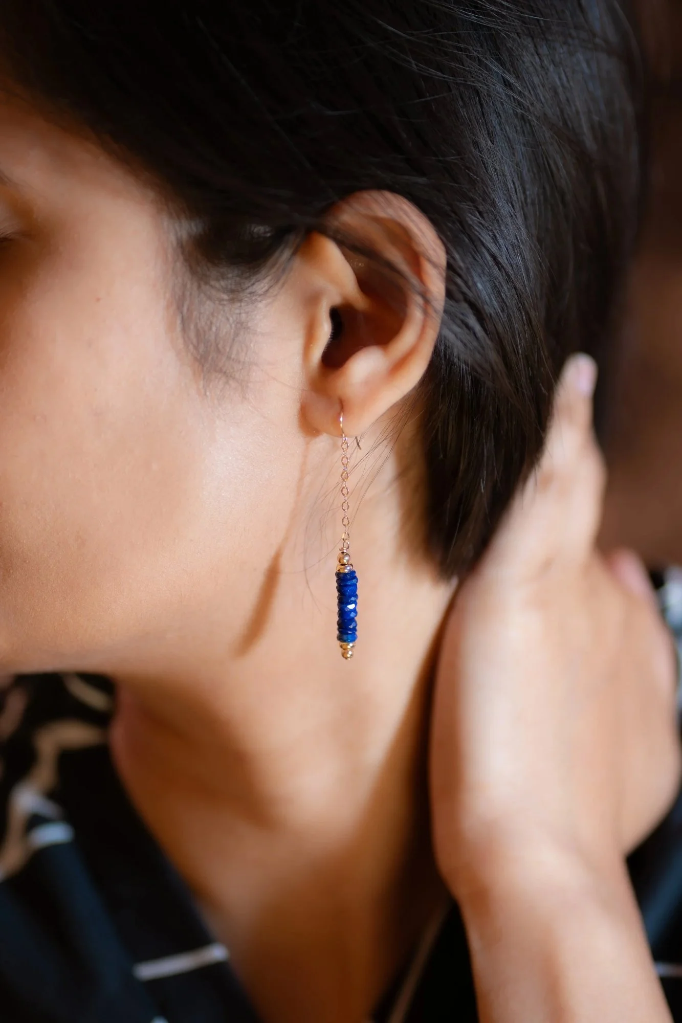 Royal blue and gold earrings which are suitable to wear with jeans or a business suit.