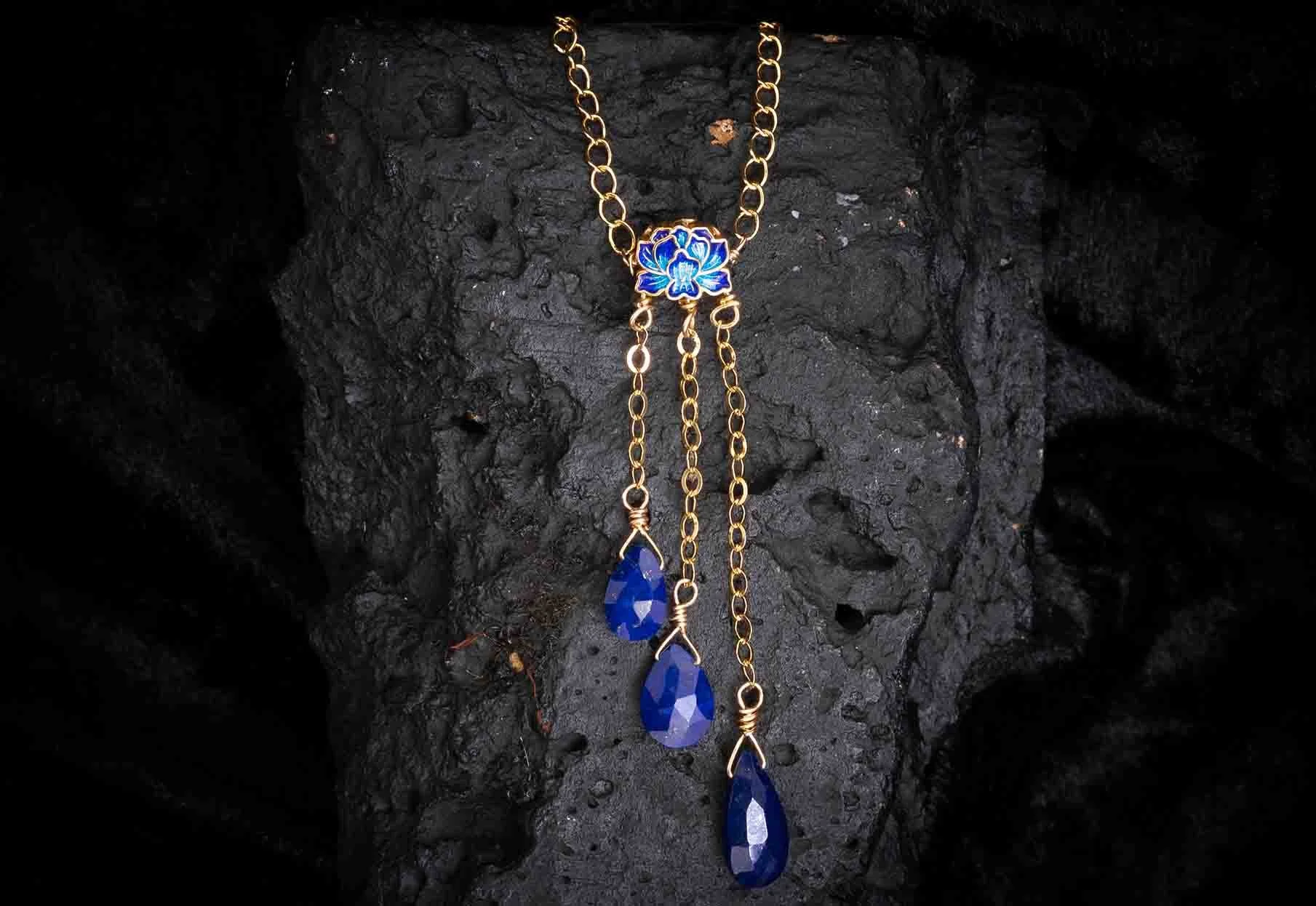 Handmade lapis lazuli statement necklace by Sarum Rocks — gold chain with faceted blue lapis lazuli teardrop pendants