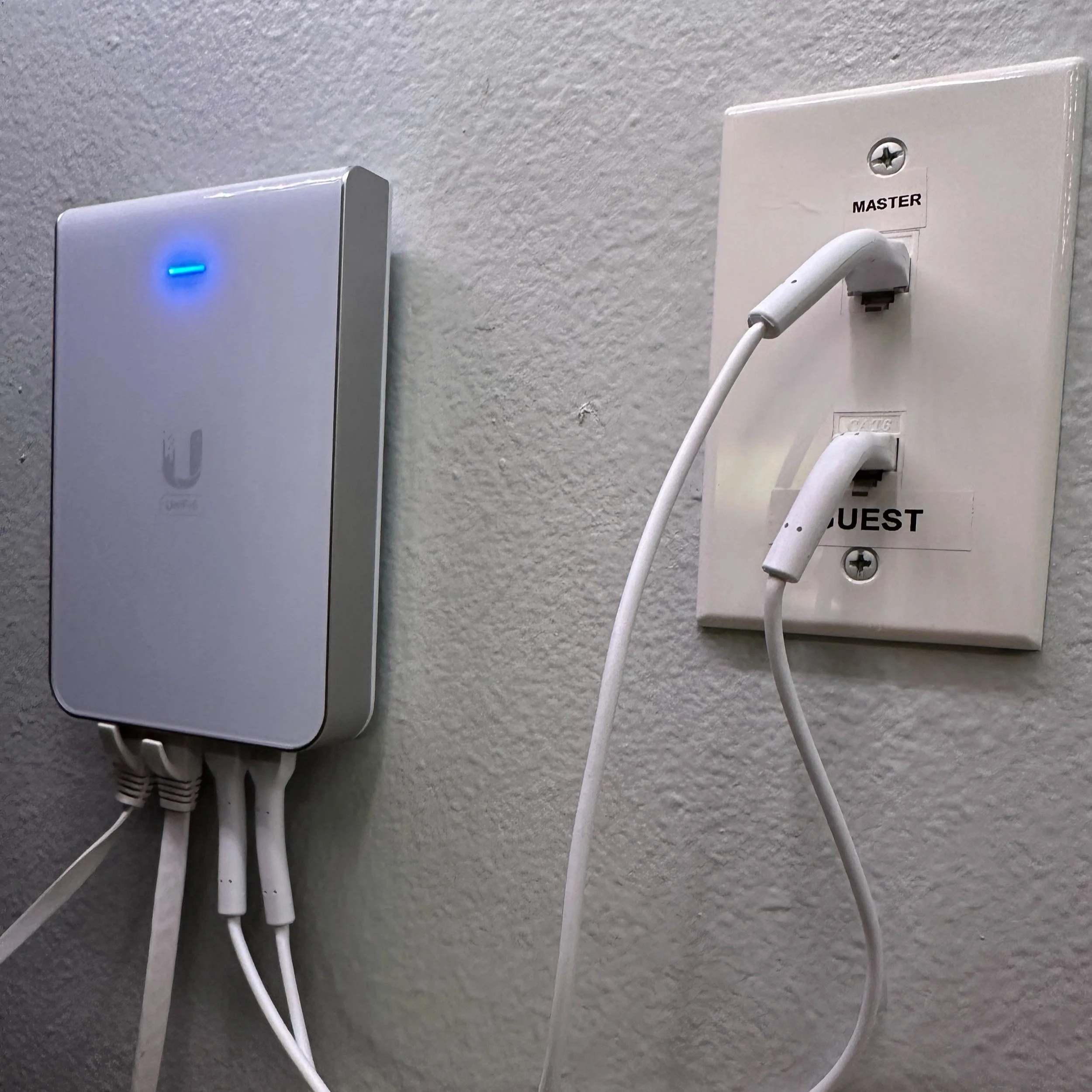 4 of 4 Access Points in a 5,000 Sqft Home.  We make use of existing home wiring to help save you costs.  The keystones on the right are two converted phone lines that now run high speed internet.