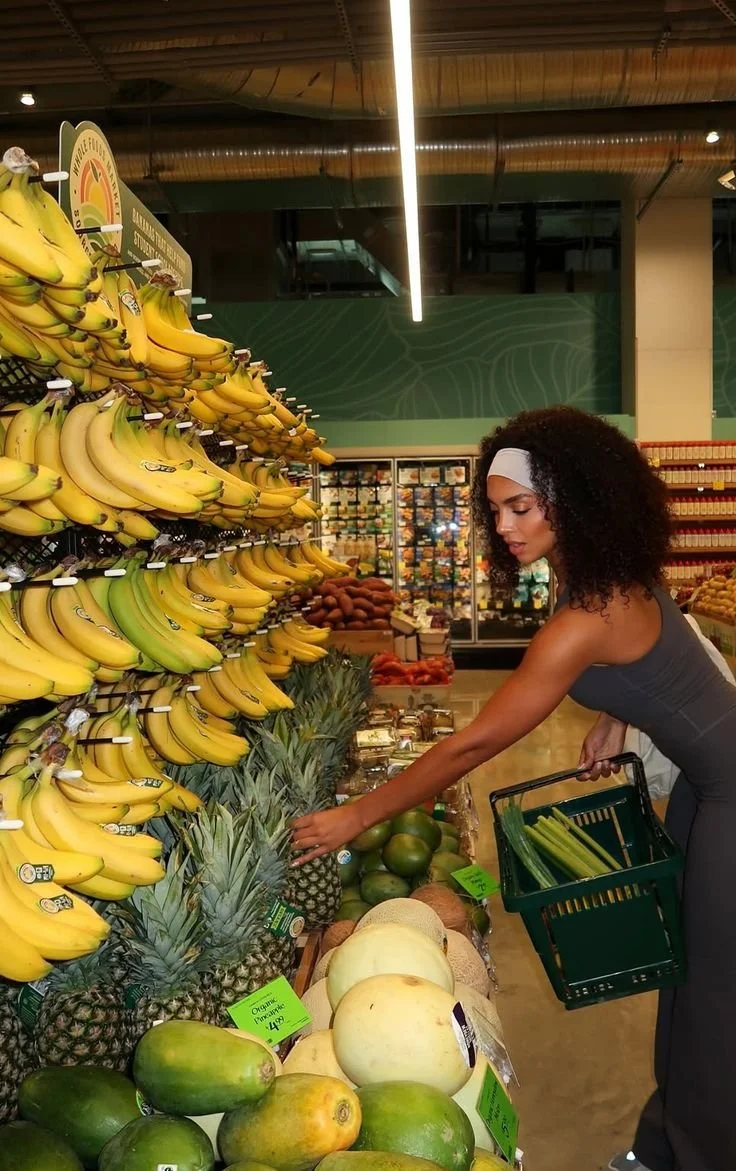 Picture of Woman Shopping for Fruit at Fruit Stand