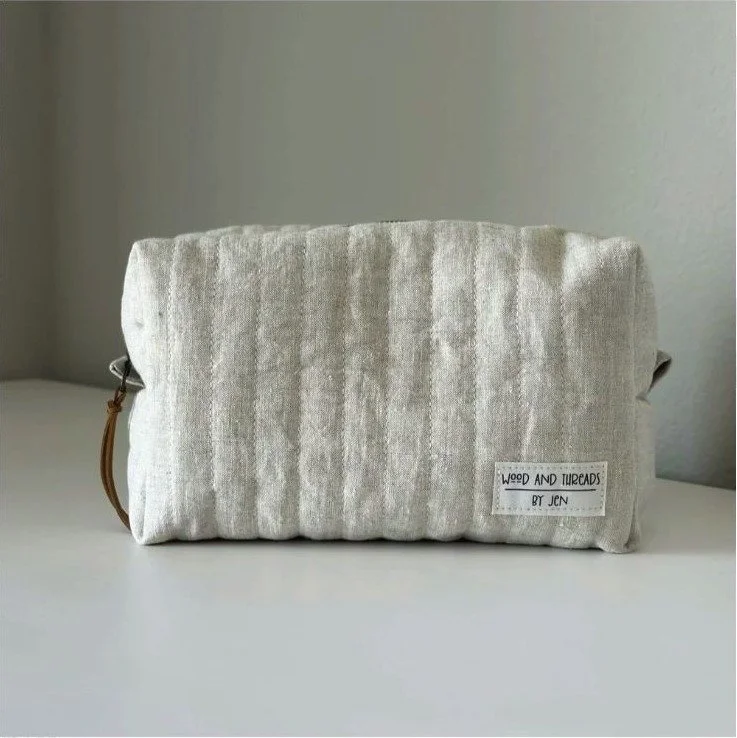 Oat linen quilted boxy pouch viewed from the front