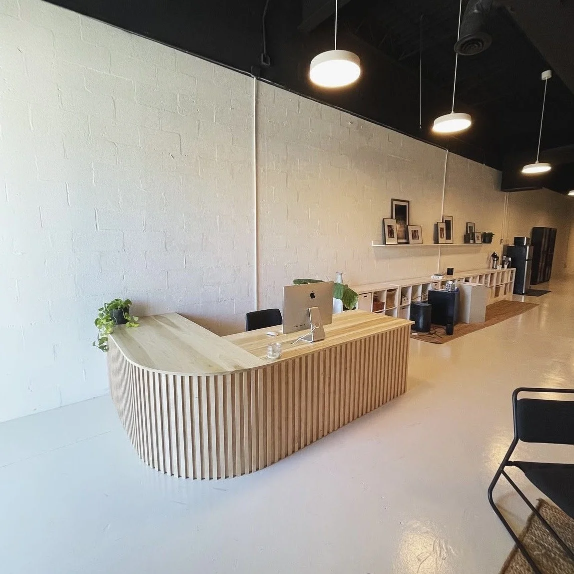 rounded reception desk with vertical slats 