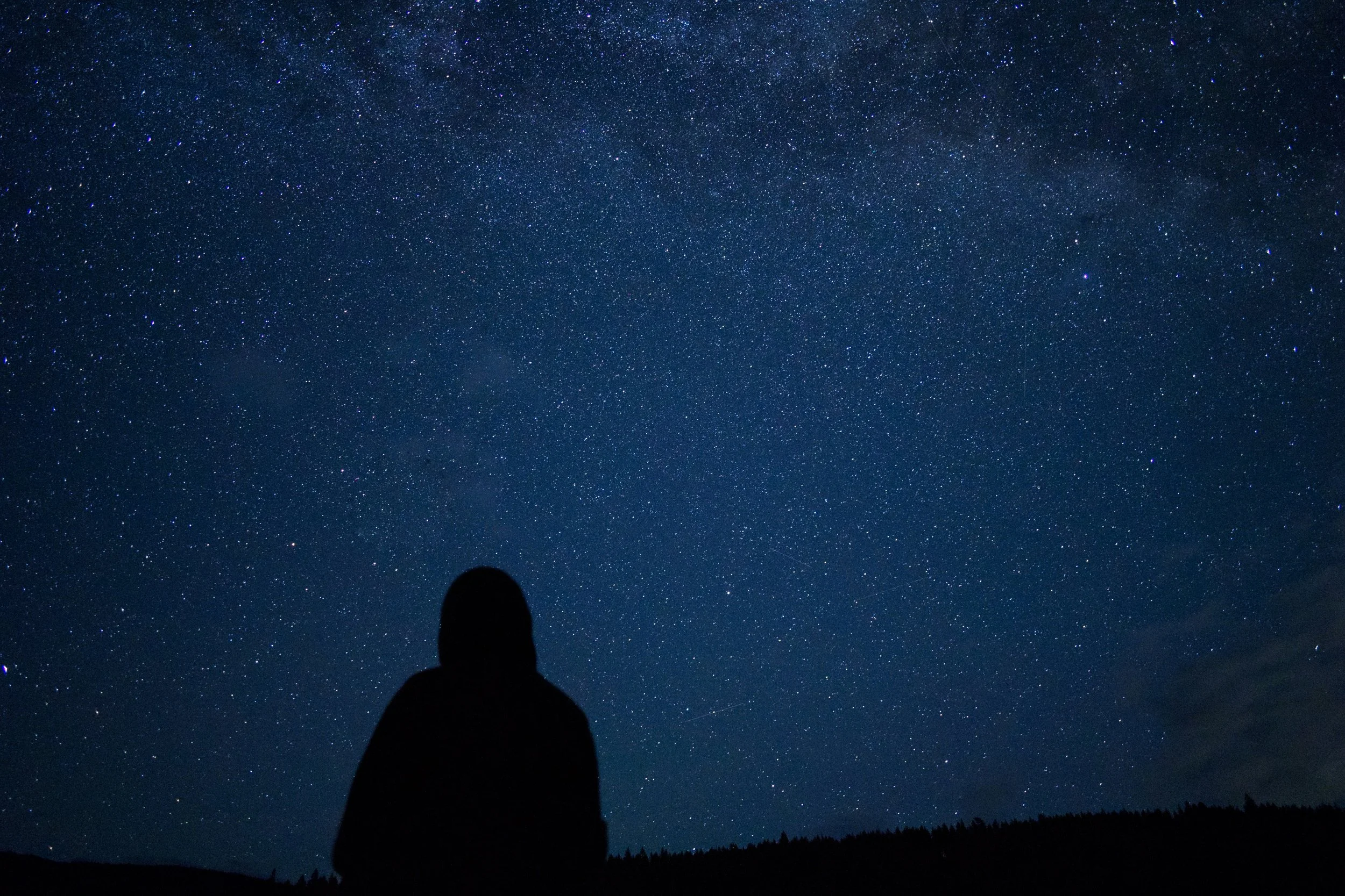 Looking at a sky with too many stars to count.