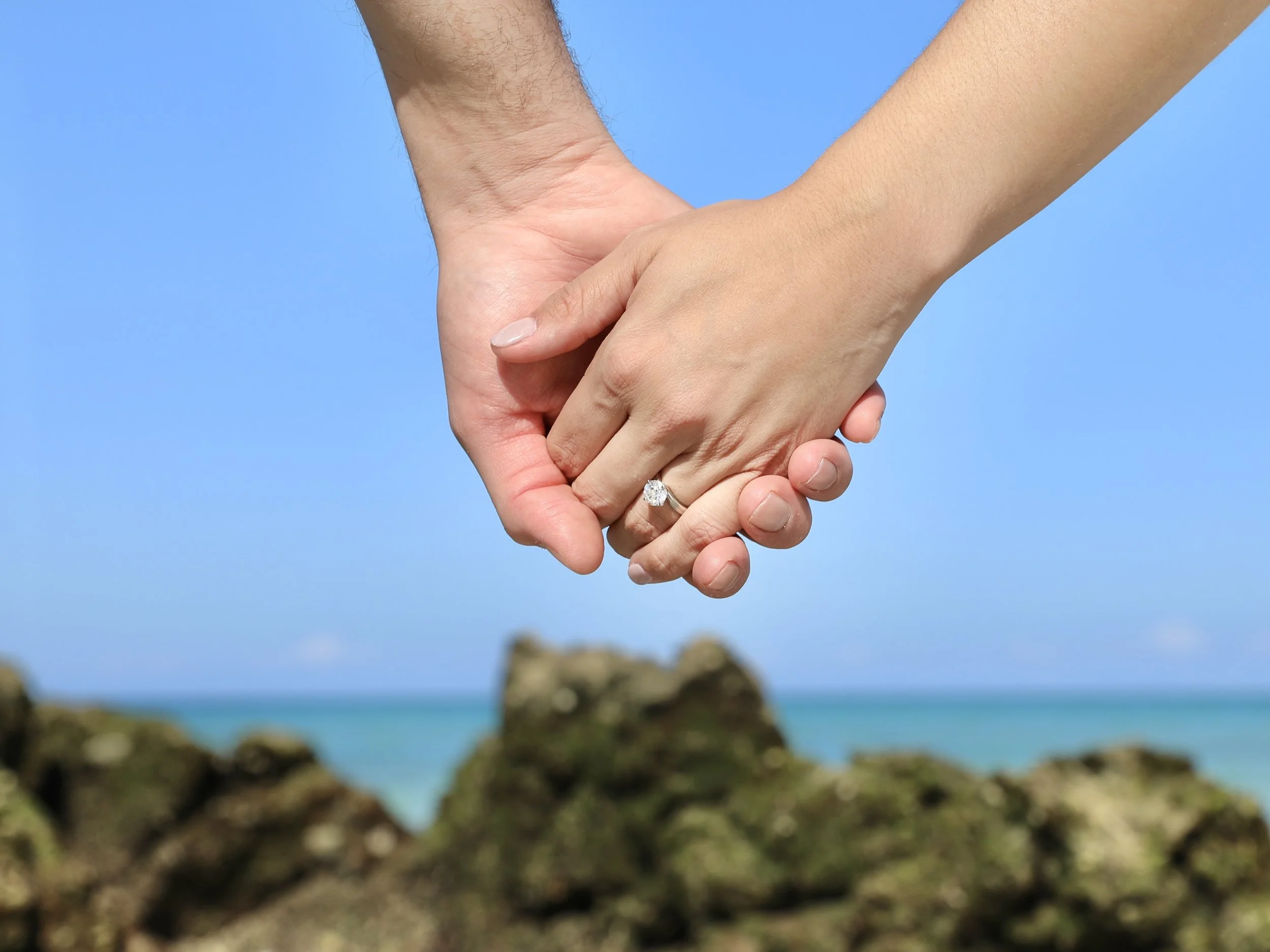 Close-up of an engagement ring during a romantic marriage proposal in Loreto, Mexico.