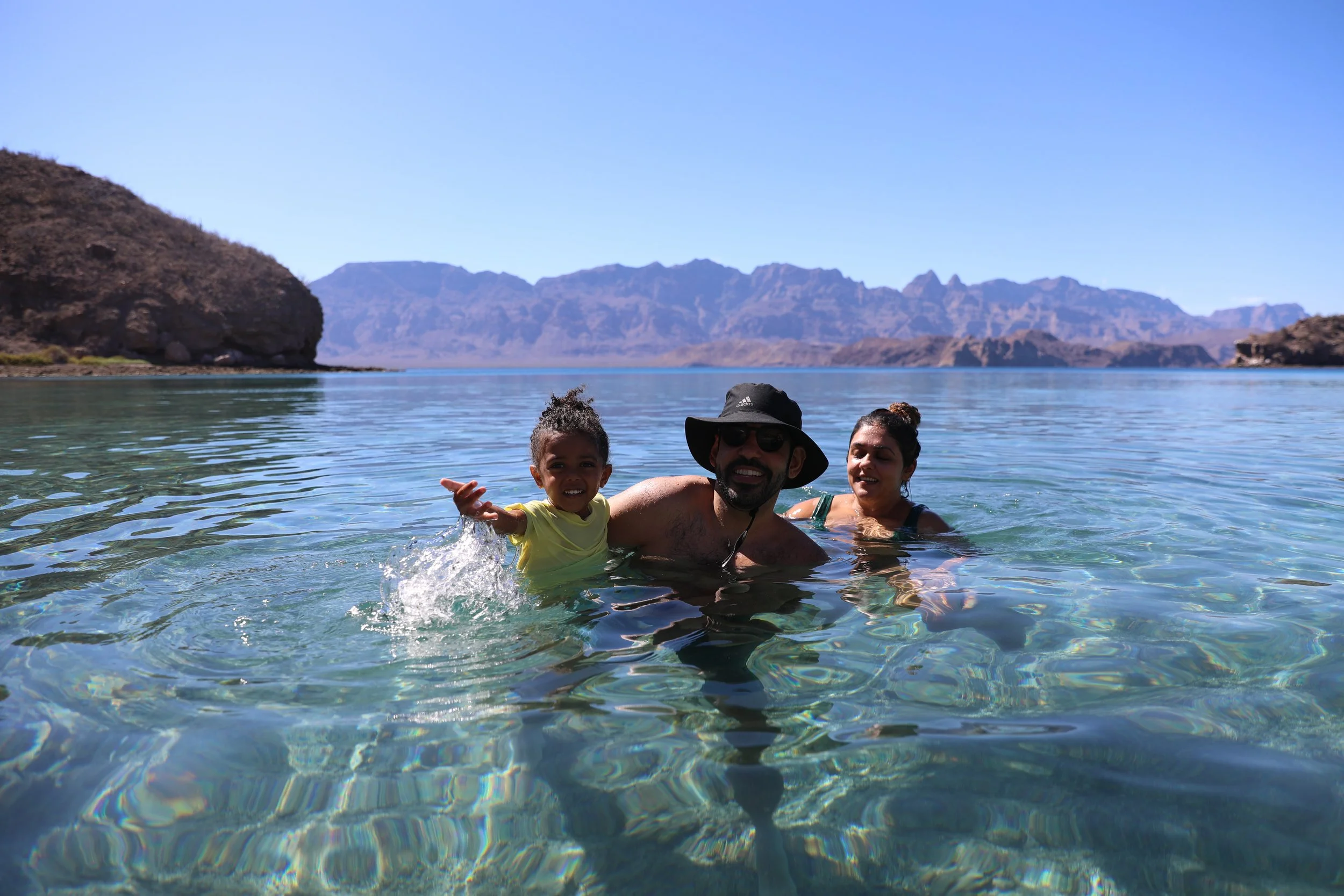 A group swimming in the crystal-clear waters of Loreto Bay National Park with Baja Adventures.