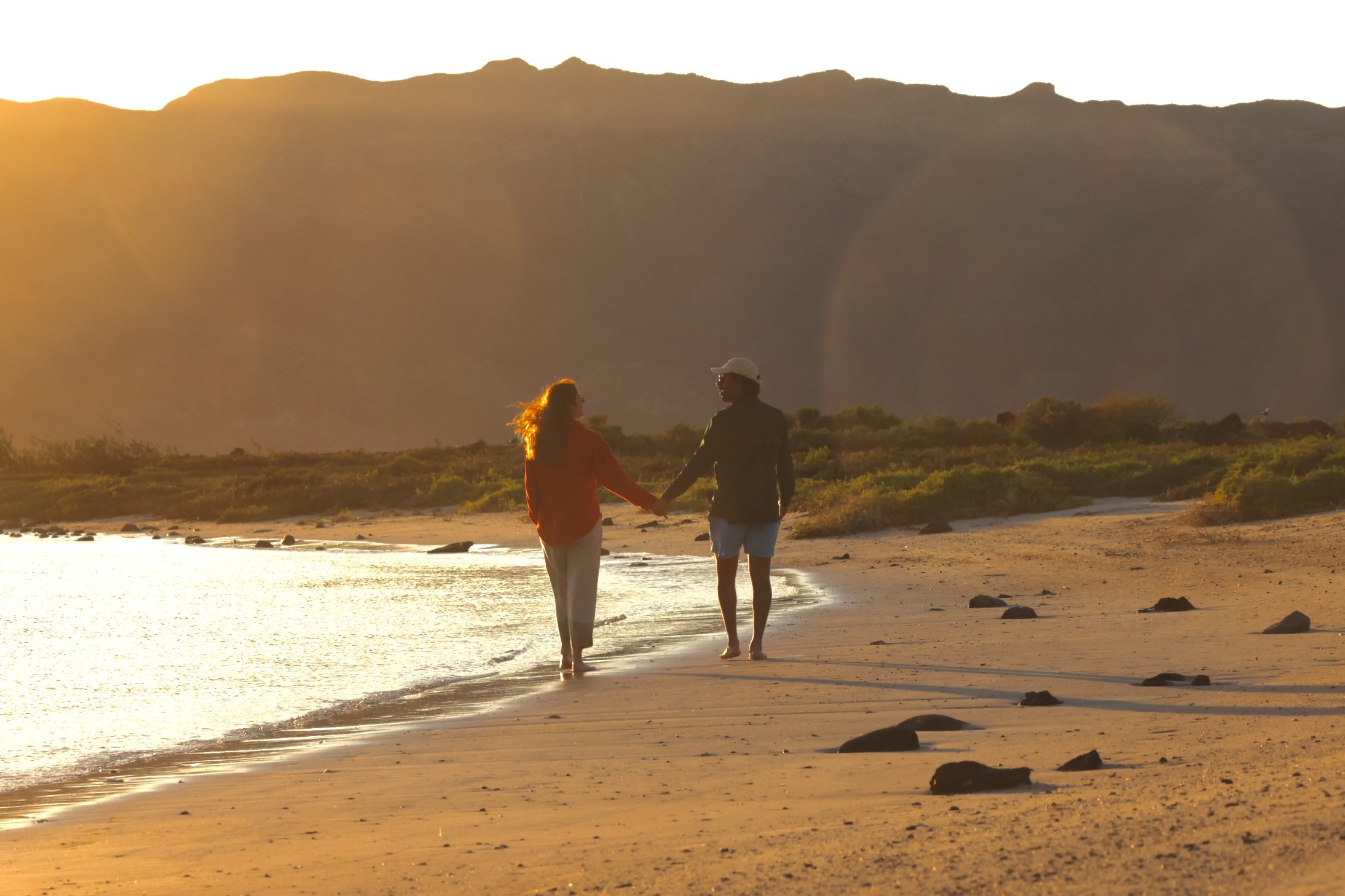 Engagement photography of a couple surrounded by pristine island landscapes in Loreto, Mexico.