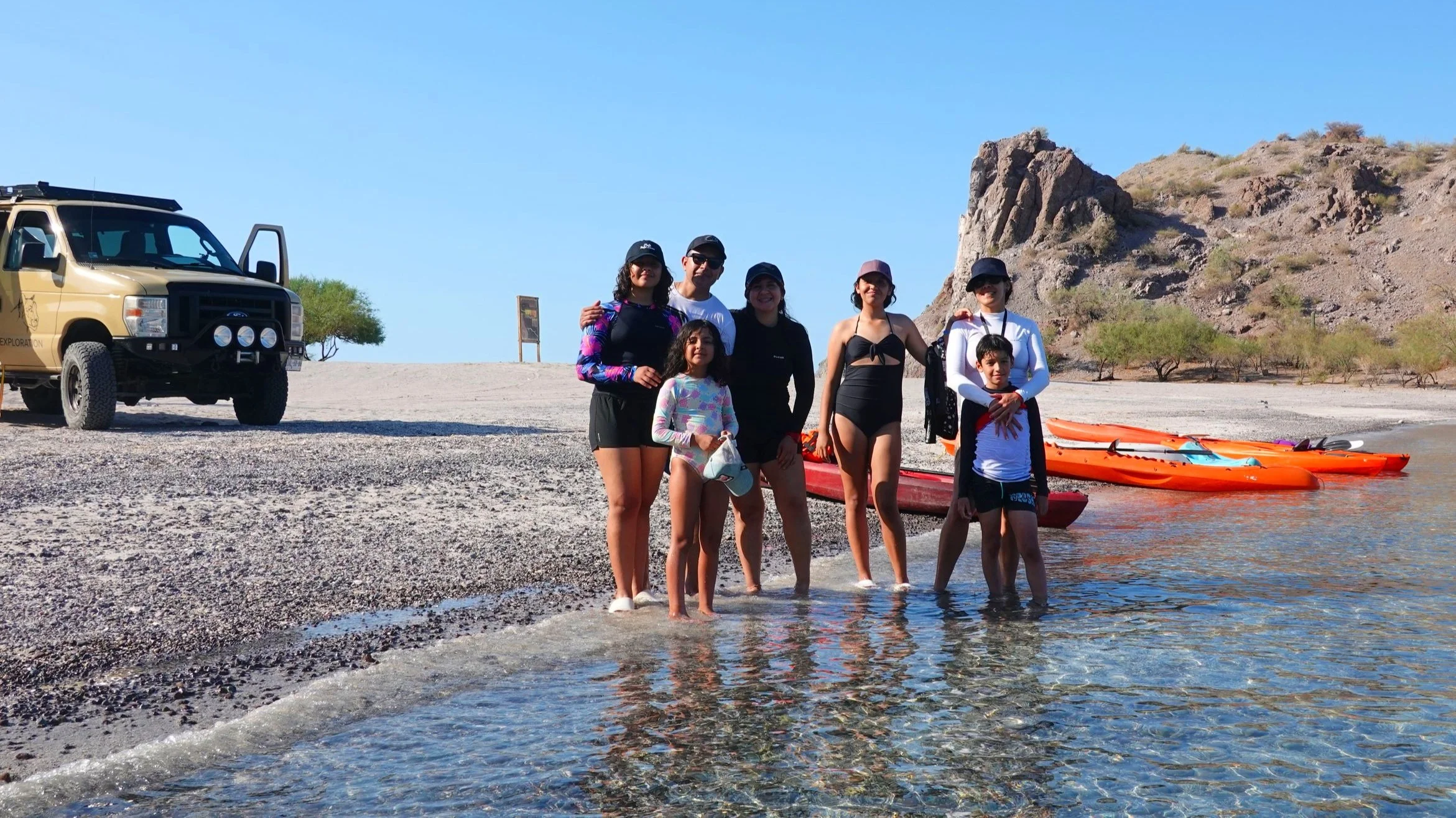 A kayaking group exploring the pristine waters of Agua Verde in the Gulf of California with Baja Adventures.