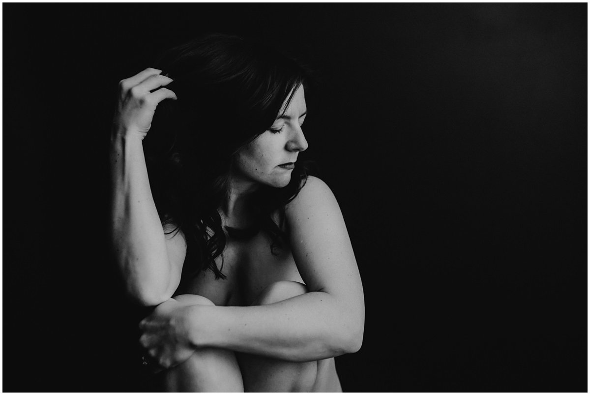A artistic finer nude portrait of a mother in a Cleveland photography studio. 