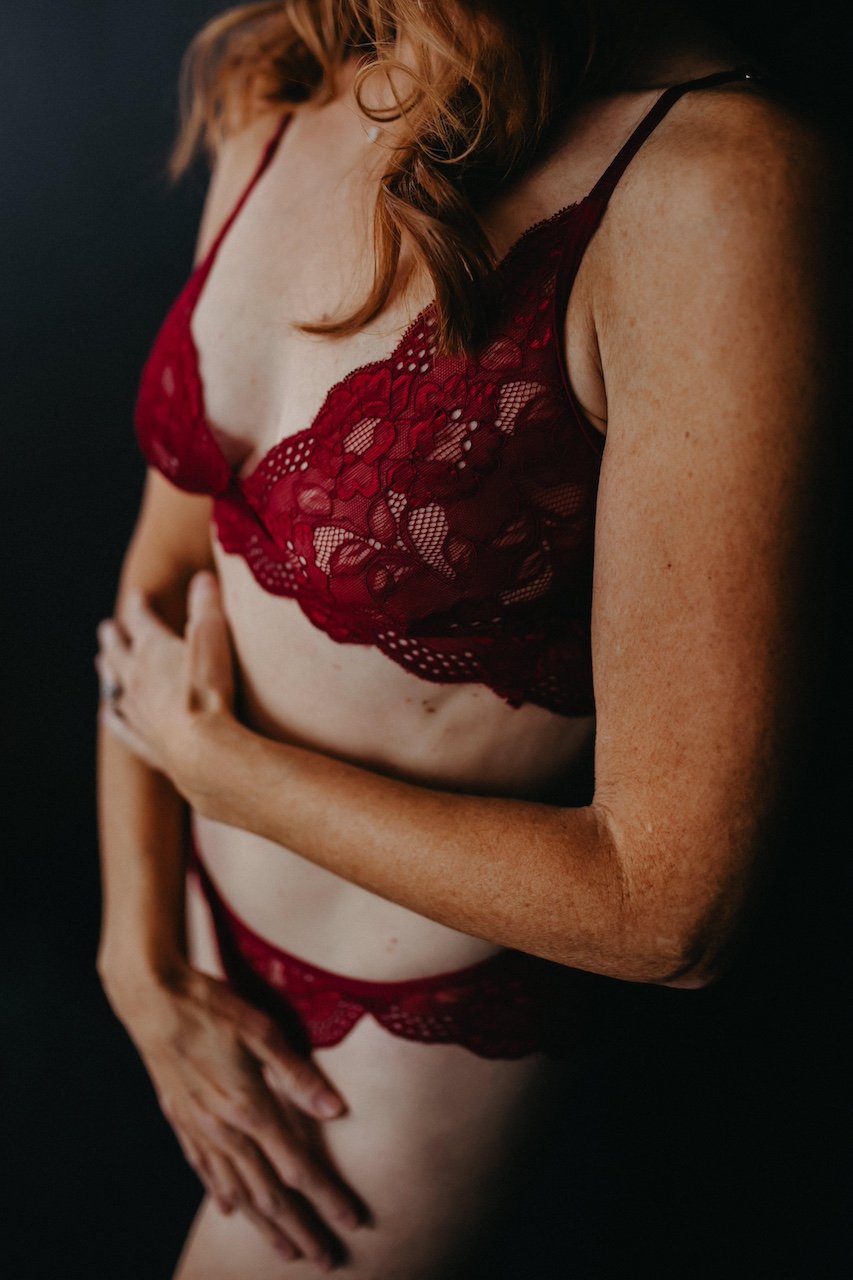 Details of body detail of a woman in red lingerie in Columbus, Ohio.