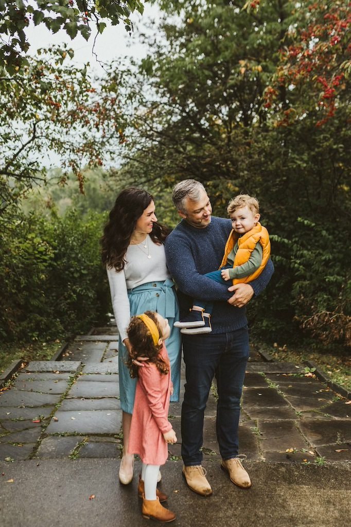 A family in Shaker Heights Ohio posing for a family photo in a park.