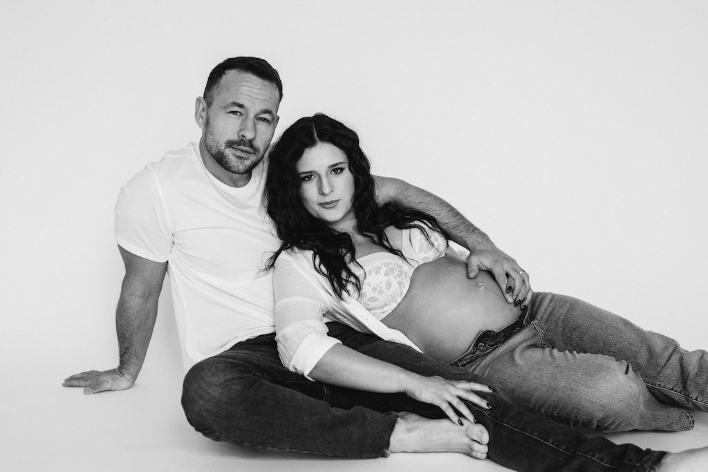 Black and white studio portrait of parents during a maternity session in Cleveland studio. 