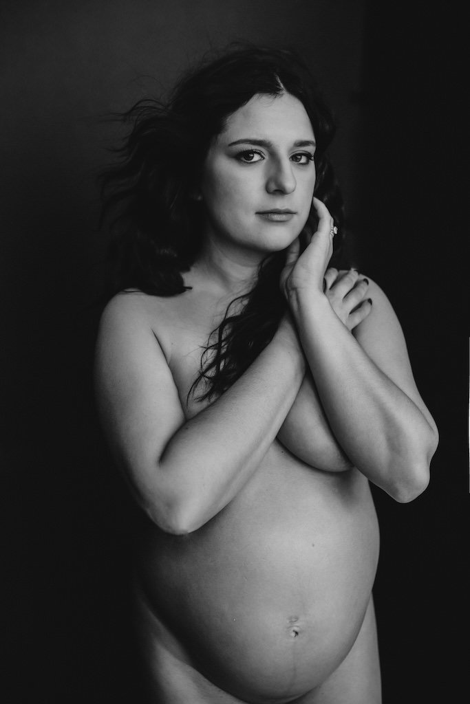 Modern boudoir maternity shoot in Cleveland studio of pregnant woman without clothes. 