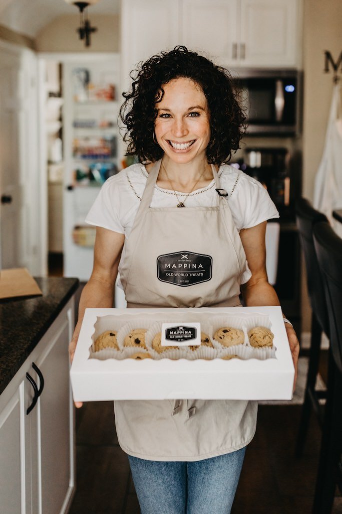 Rachel Morse of Mappina Bakery holding home-made gluten free goods during a branding shoot. 