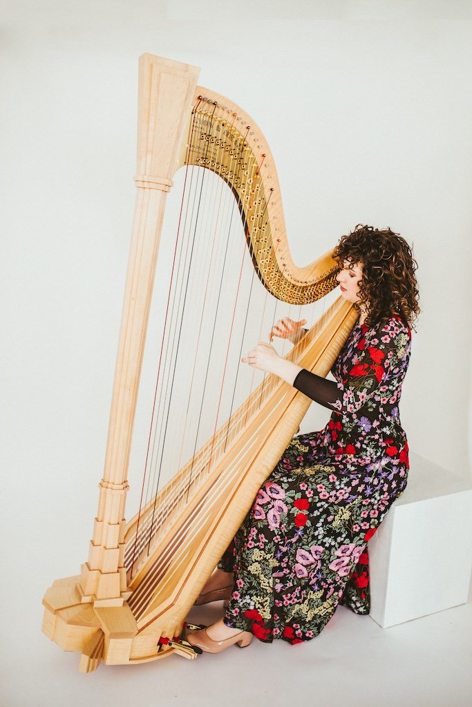 Woman playing cello during a branding shoot in a Cleveland photography studio. 