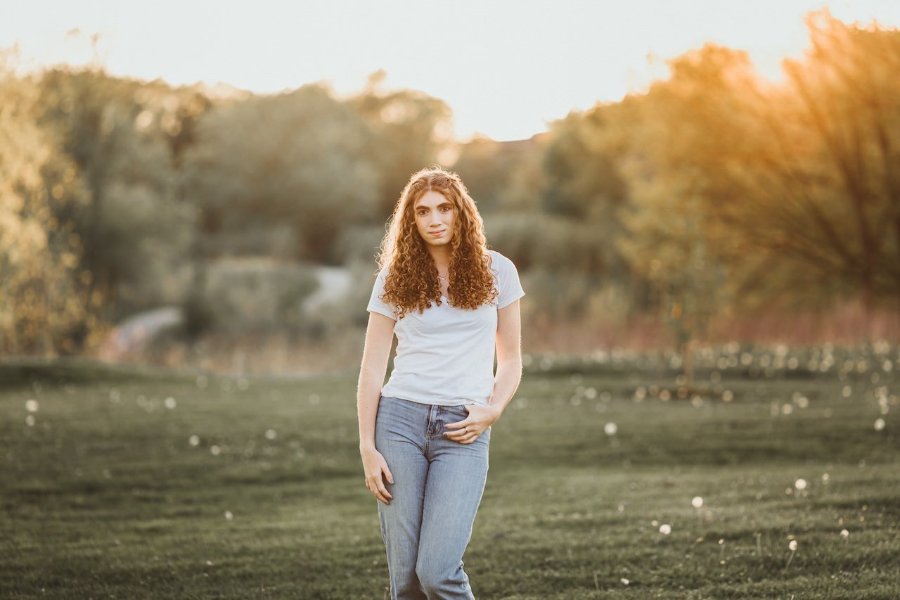 A senior shoot of girl in jeans in Acacia Reservation in Cleveland. 