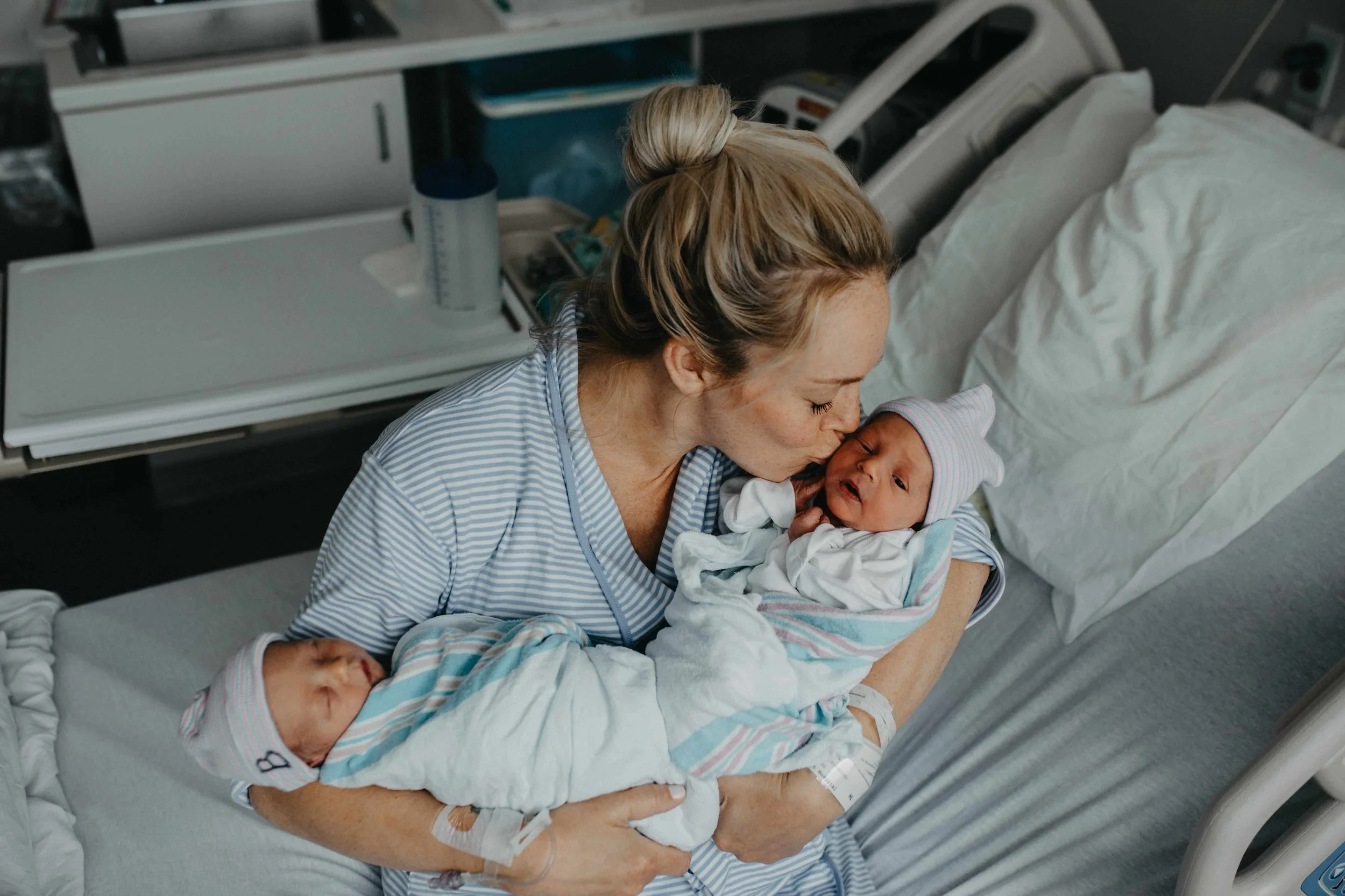 Tender Fresh 48 Moment: Mother Kisses Newborn Twin at Hillcrest Hospital, Cleveland