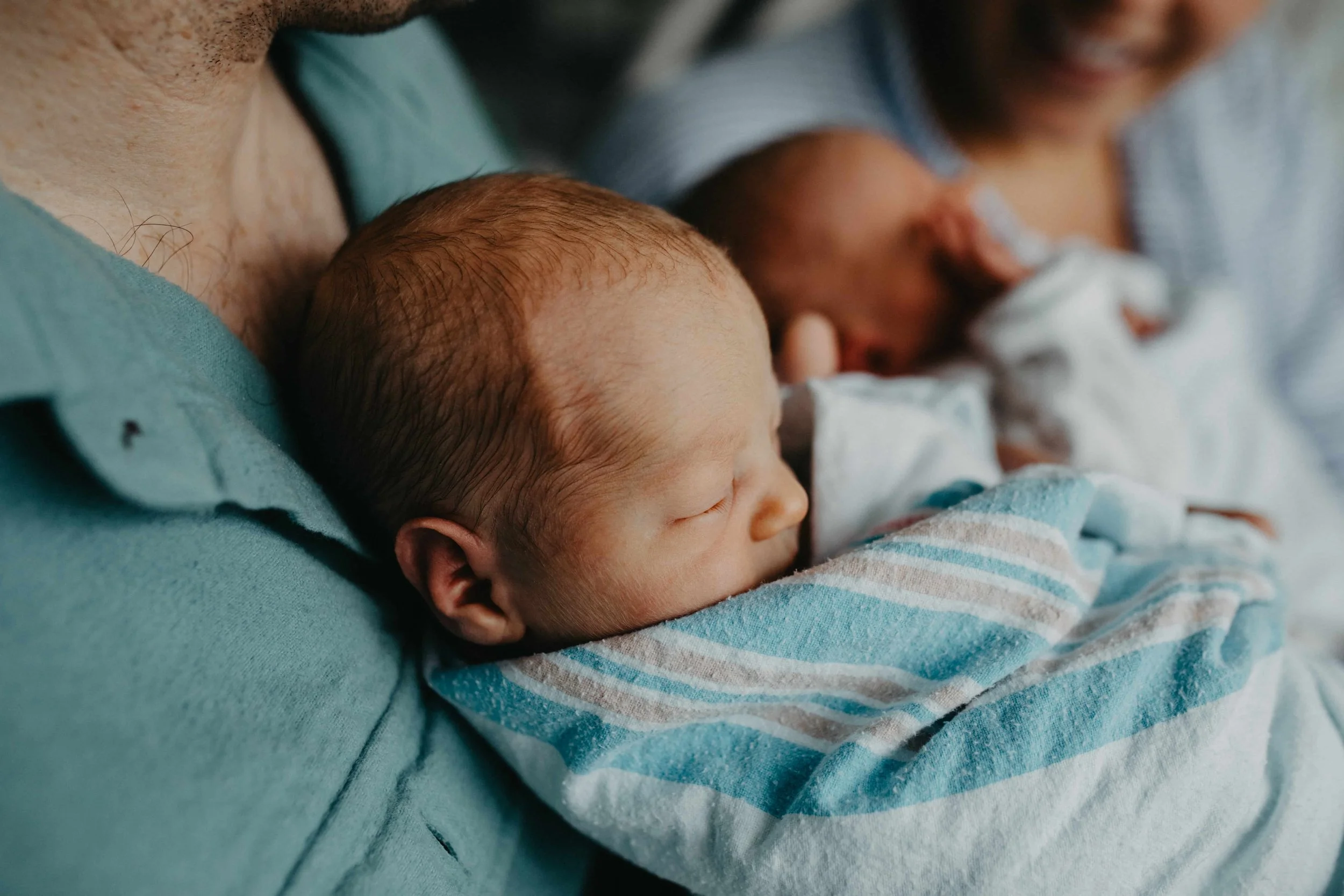 Intimate Fresh 48: Sleeping Newborn Twin in Father's Arms, Cleveland Hospital