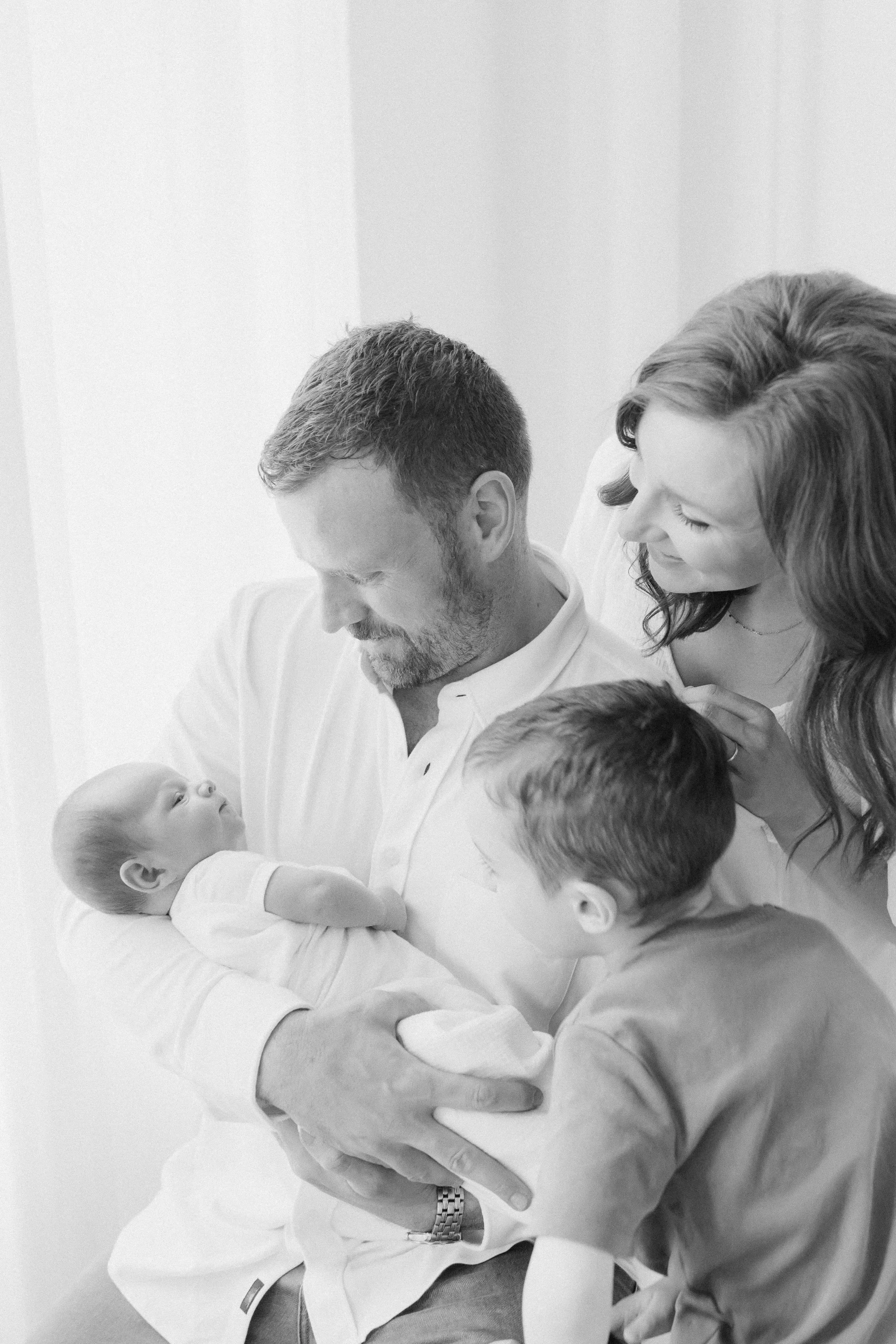 Lifestyle Newborn Photographer Cleveland | Black and White Family Portrait with Newborn