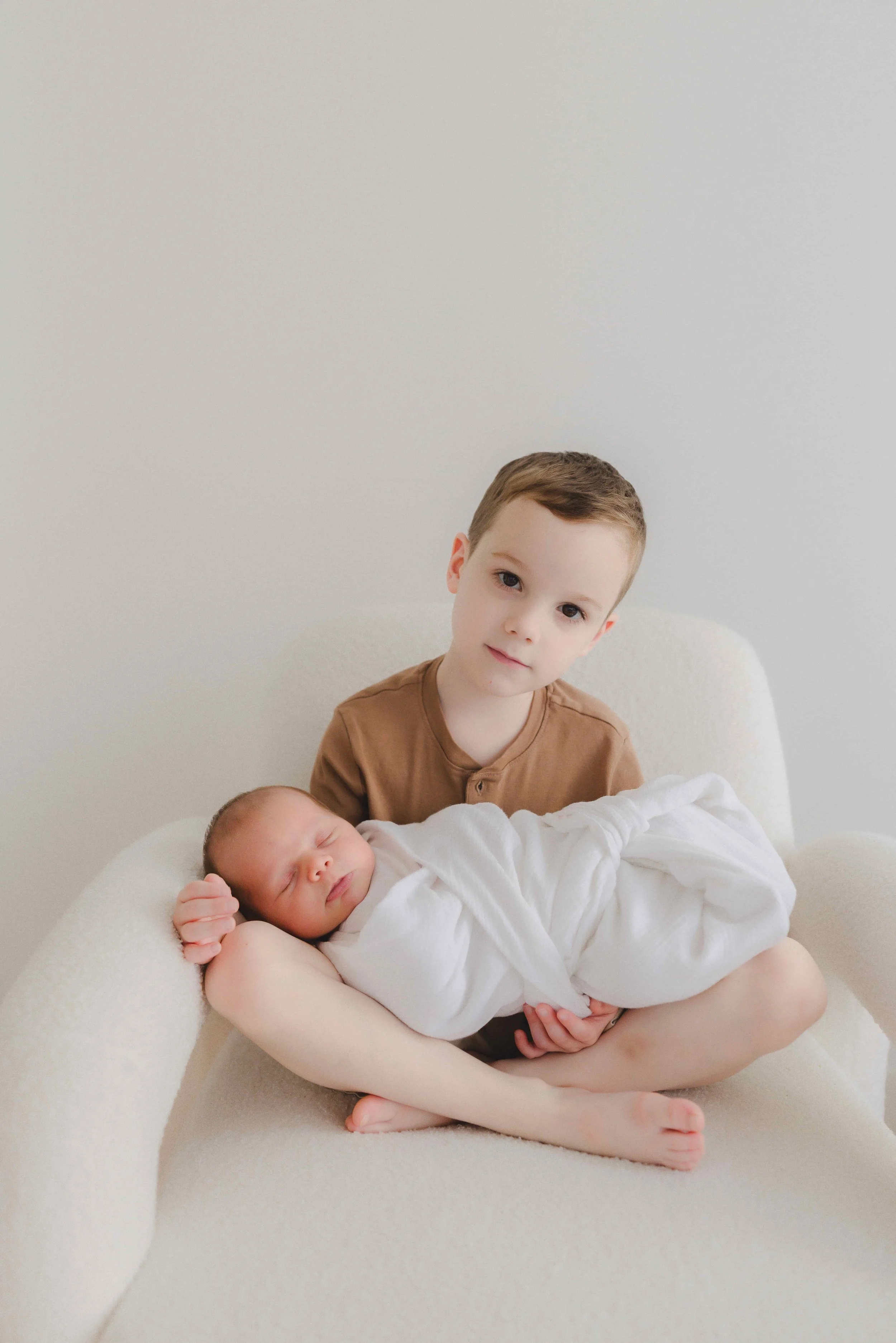 Studio Newborn Photographer Ohio | Big Brother Holding Newborn Baby